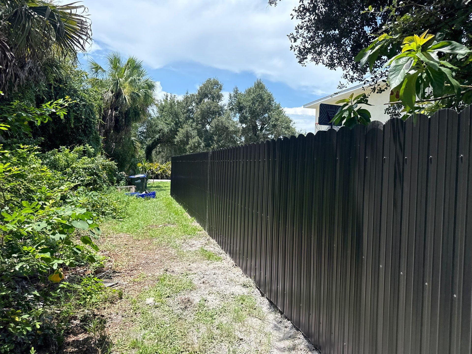 Bronze Scalloped Metal Privacy Fence Installation in North Port by True Fence LLC