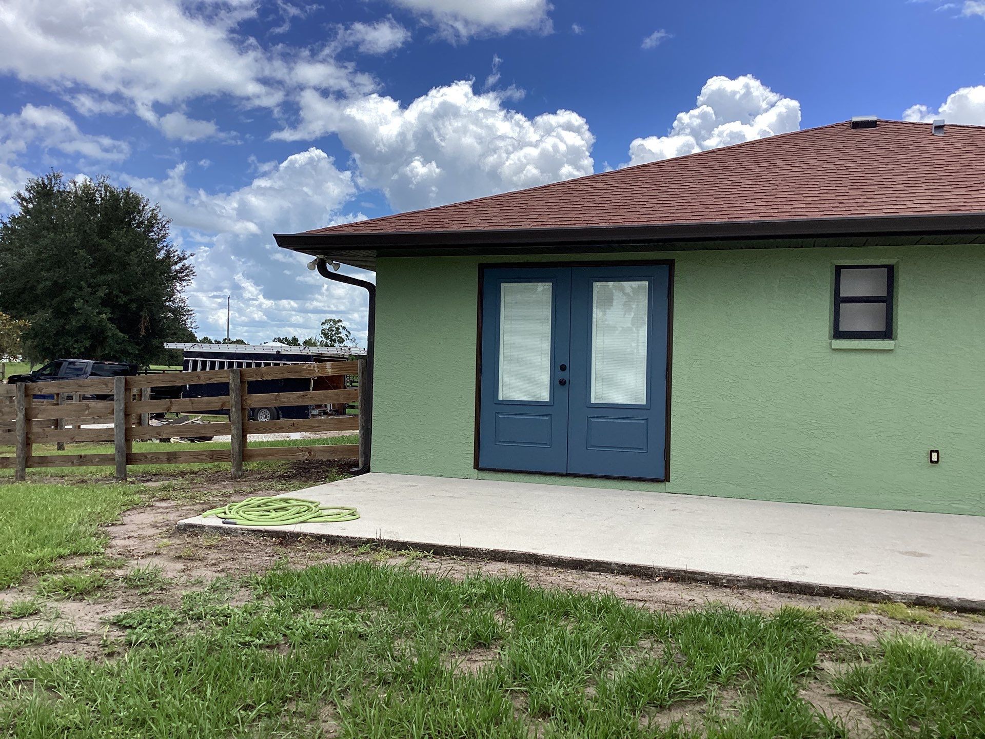 Musket brown downspouts with 6-inch K-Style gutter installation in Myakka City, FL by Gutter Professors