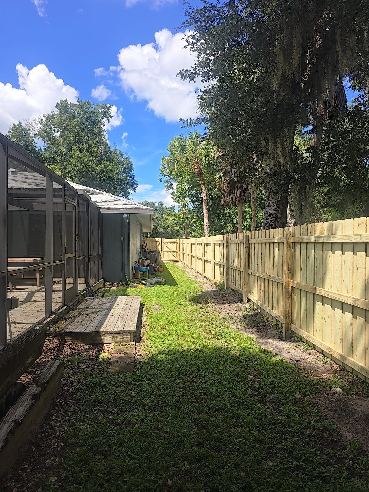Wood Privacy Fence Installation with Double Gate in Port Charlotte by True Fence LLC