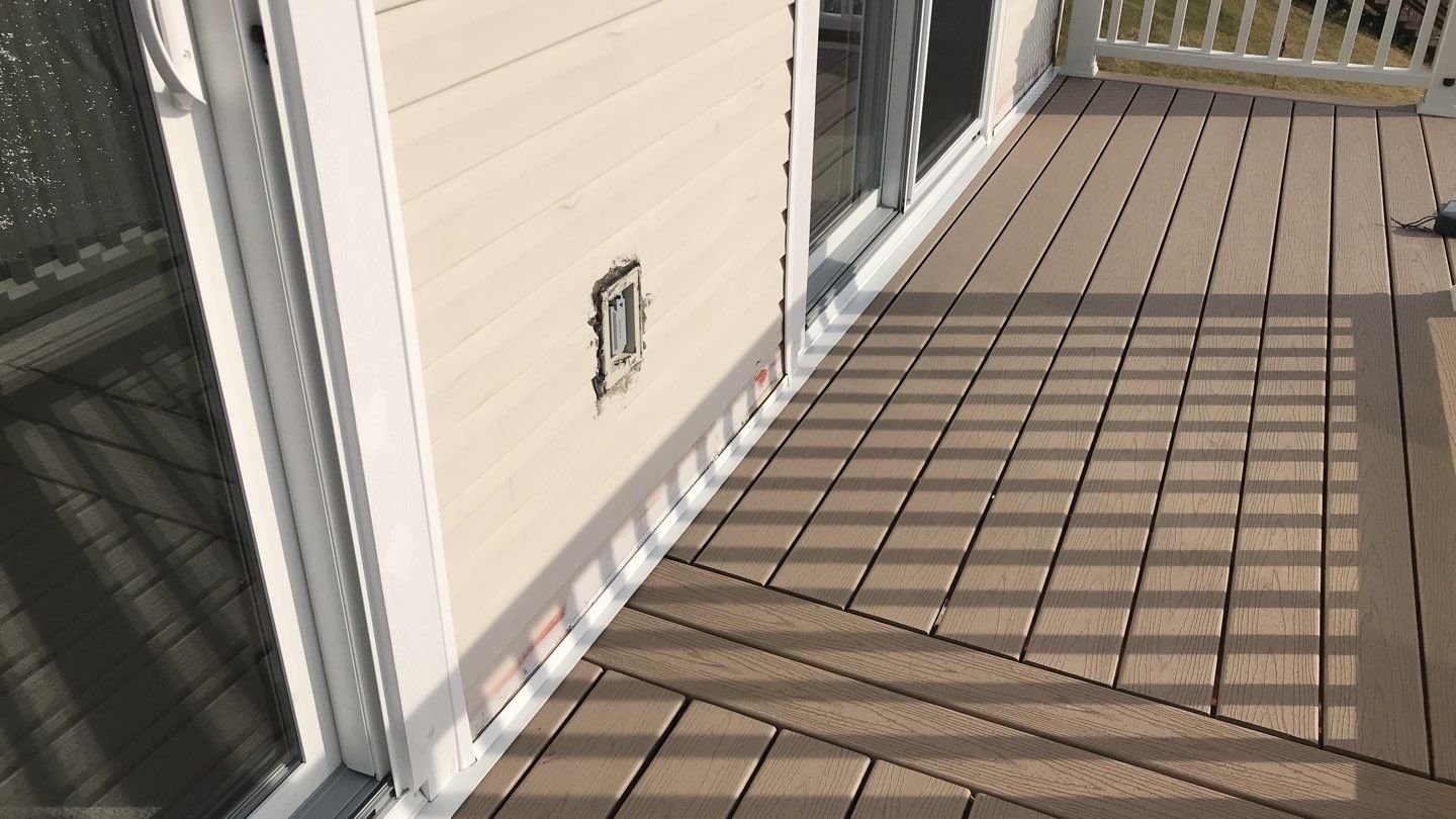 Deck Refurbush and Door Replacement using Trex Decking and Railing. Polaris Patio Doors by Secure Construction Company Inc