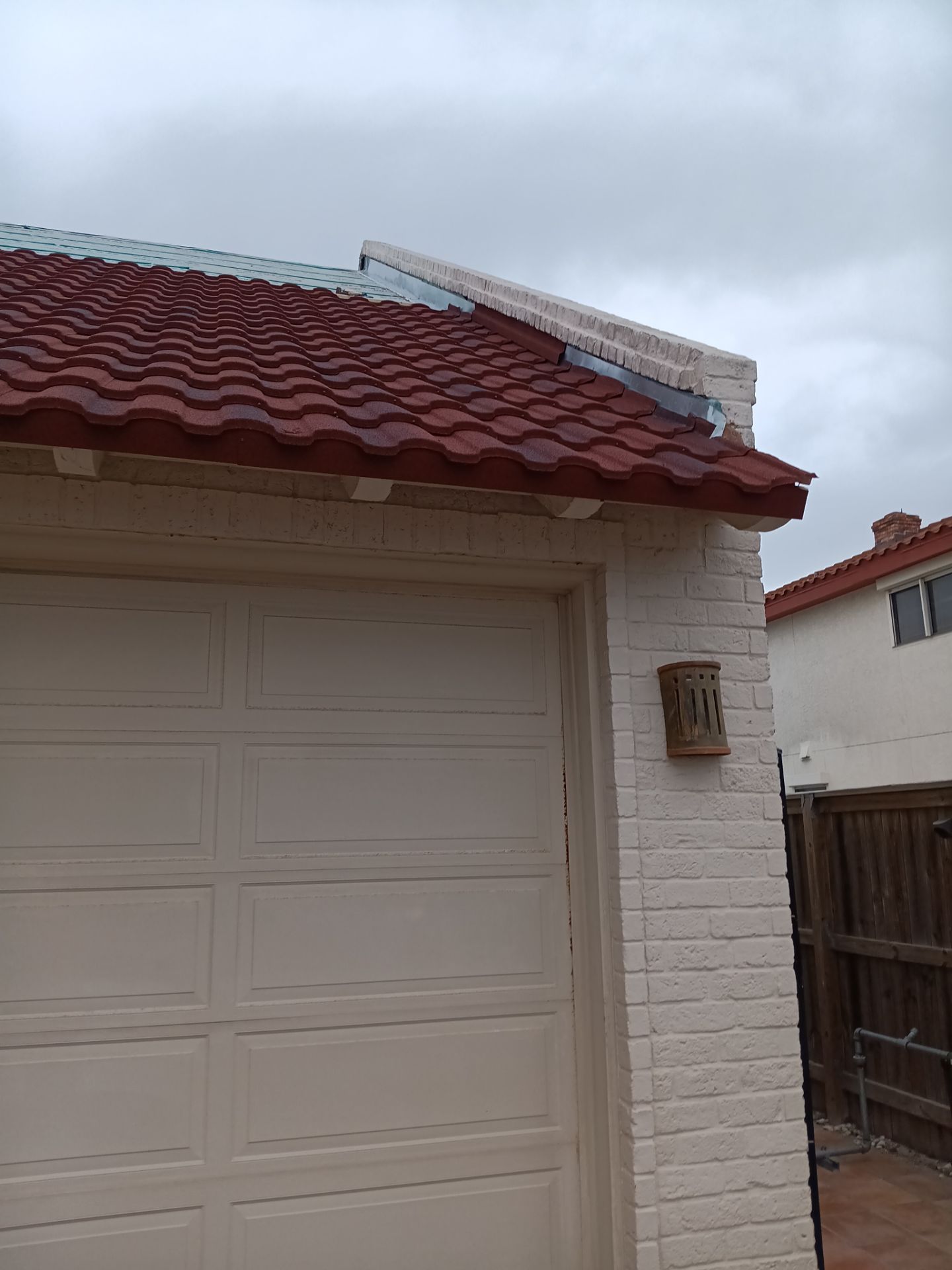 Off with the Tile and on with the TILCOR stone coated metal. by Bayfront Roofing and Construction