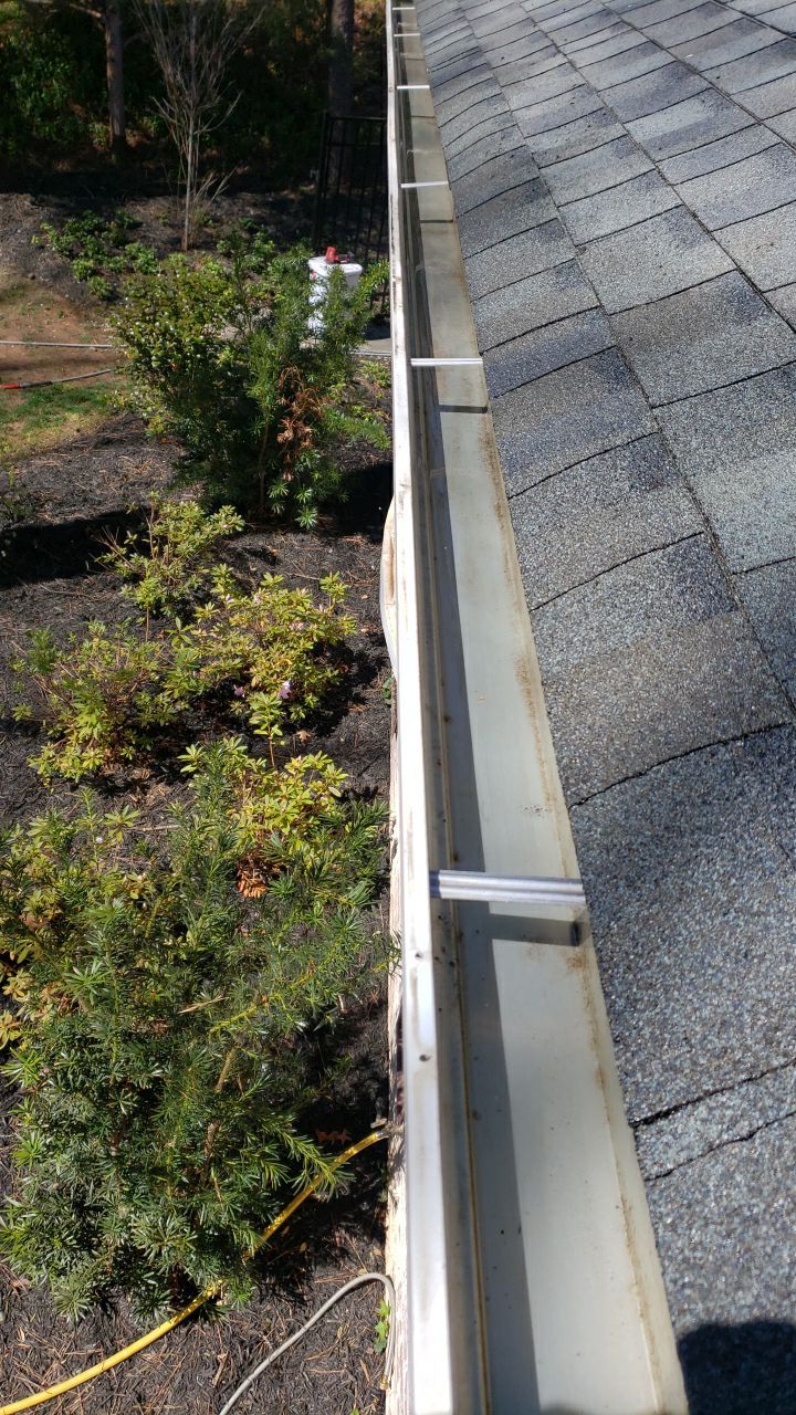 Gutter Cleaning using water by Power Wash Masters LLC
