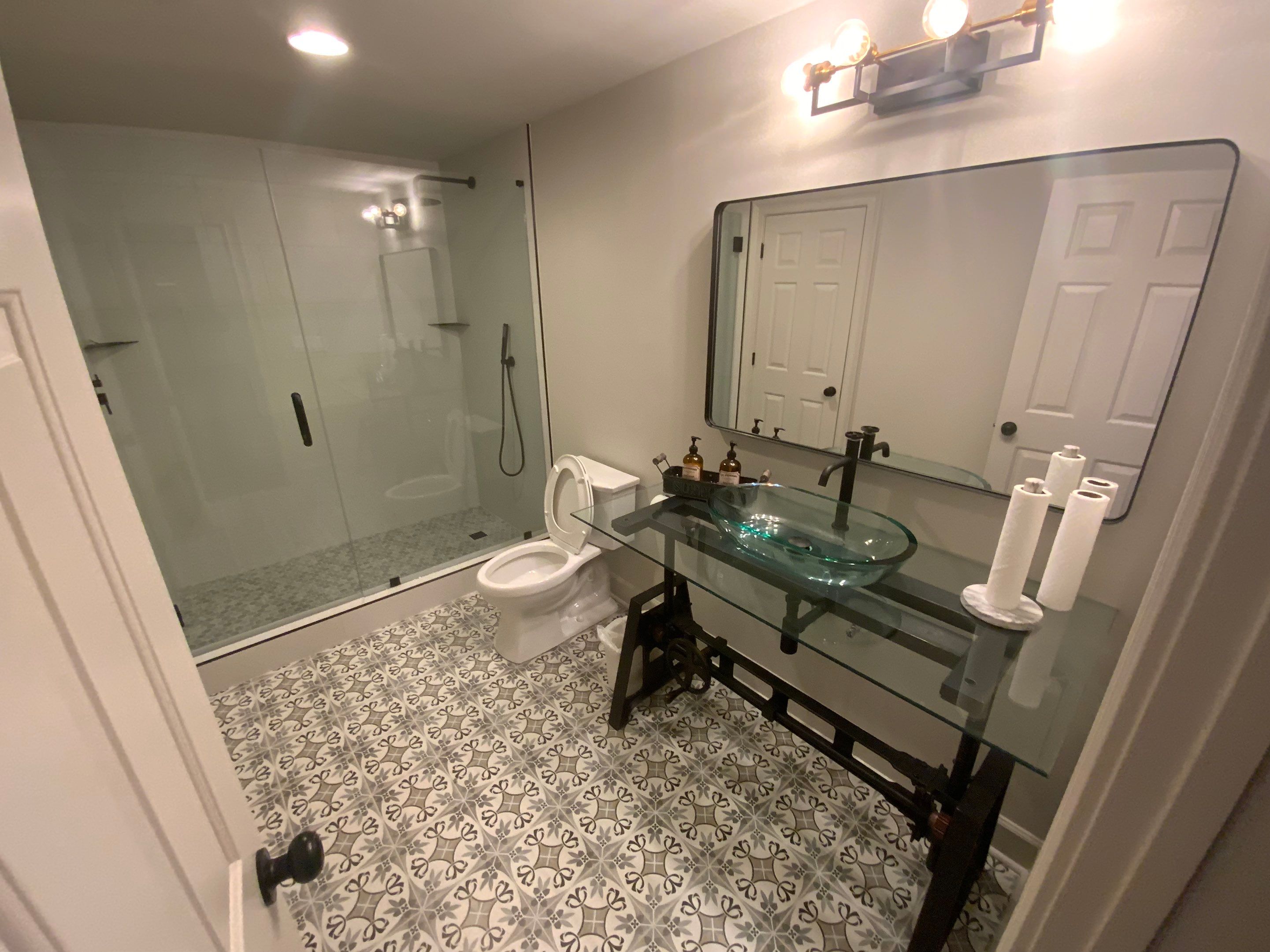Finished Basement Renovation Featuring Home Theater and Custom Wine Cellar by Swift Home Renovations
