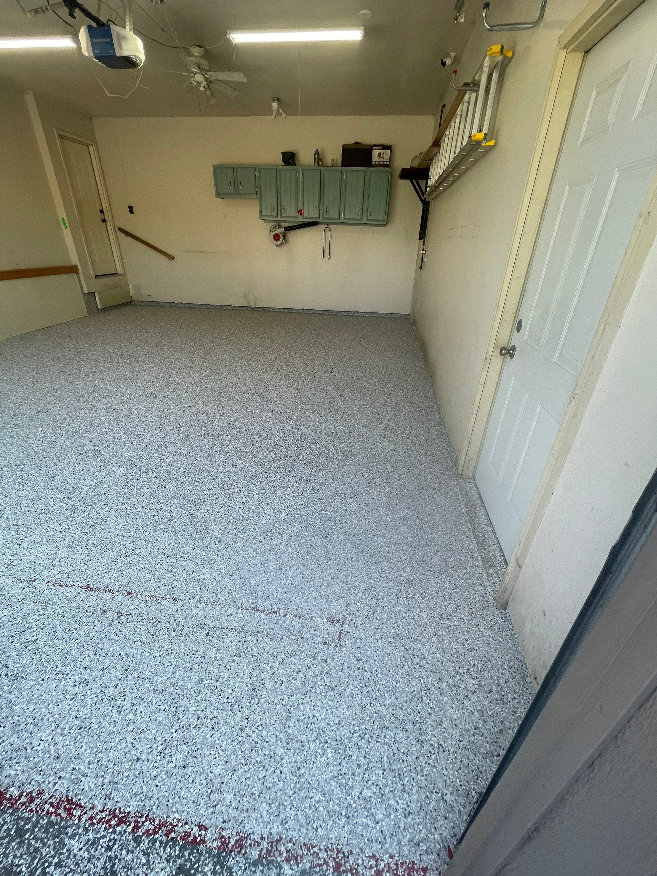 Multi-Stall Garage Floor Coating Installation in Sioux Falls by Select Painting, Coatings & Garage Cabinets