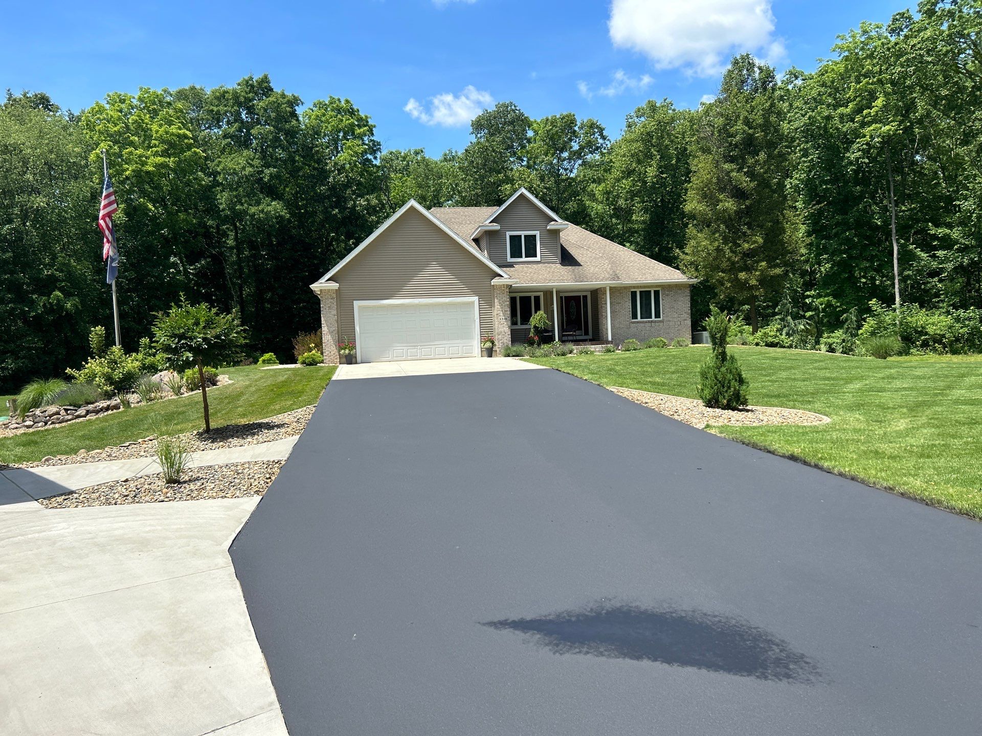 High end residential driveway by Quality Asphalt & Maintenance LLC