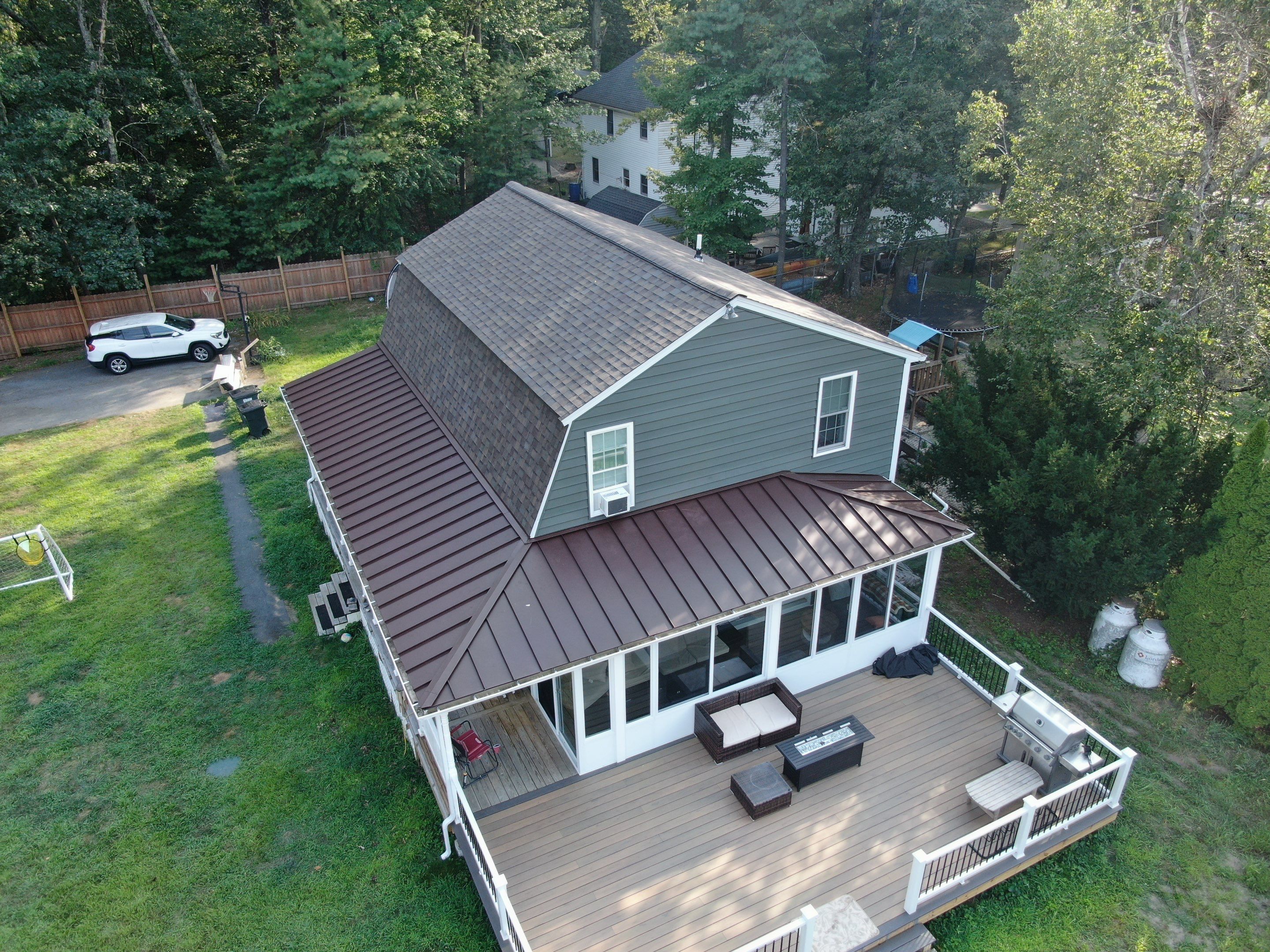 Full Roof Replacement & Farmers Porch Restoration – Asphalt + Standing Seam Metal by Mighty Dog Roofing of Greater Middlesex County