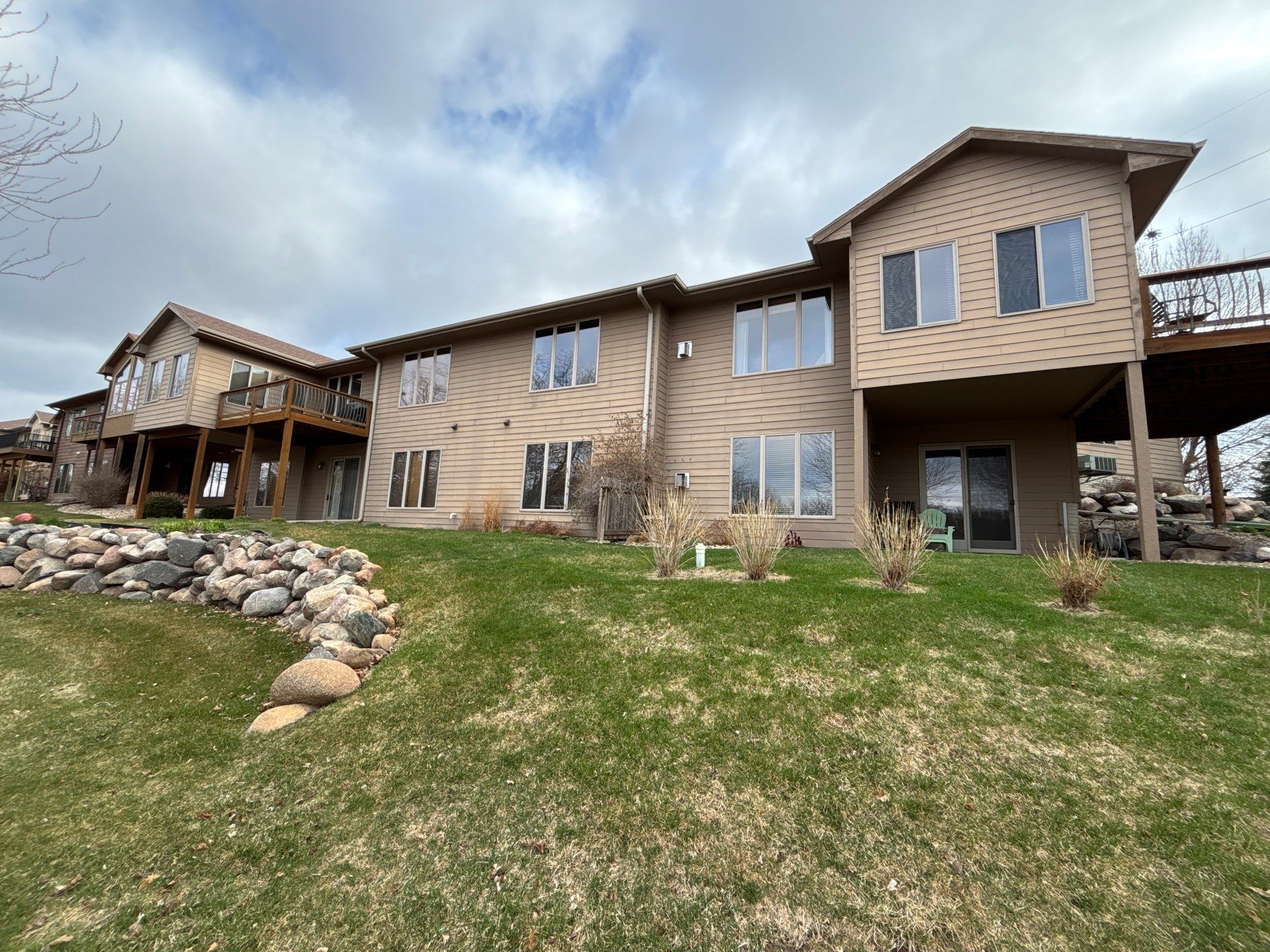 Multi-Story Residential Exterior Painting and Siding Refresh in Sioux Falls by Select Painting, Coatings & Garage Cabinets