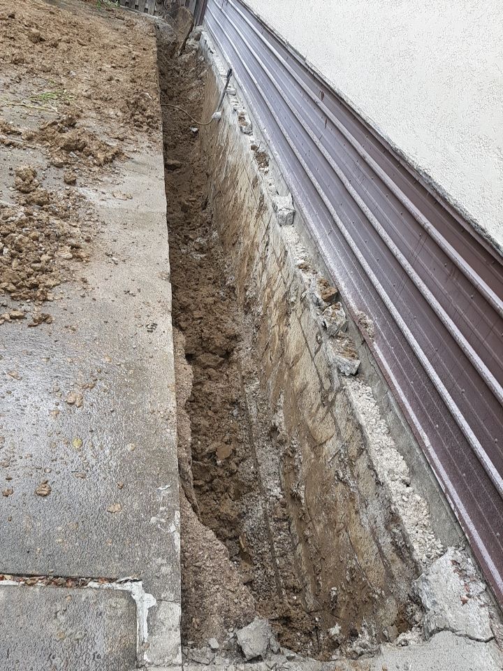 Exterior Deep Waterproofing System with Wall Push Back and Steel Beams Reinforcement by Toledo Basement Repair
