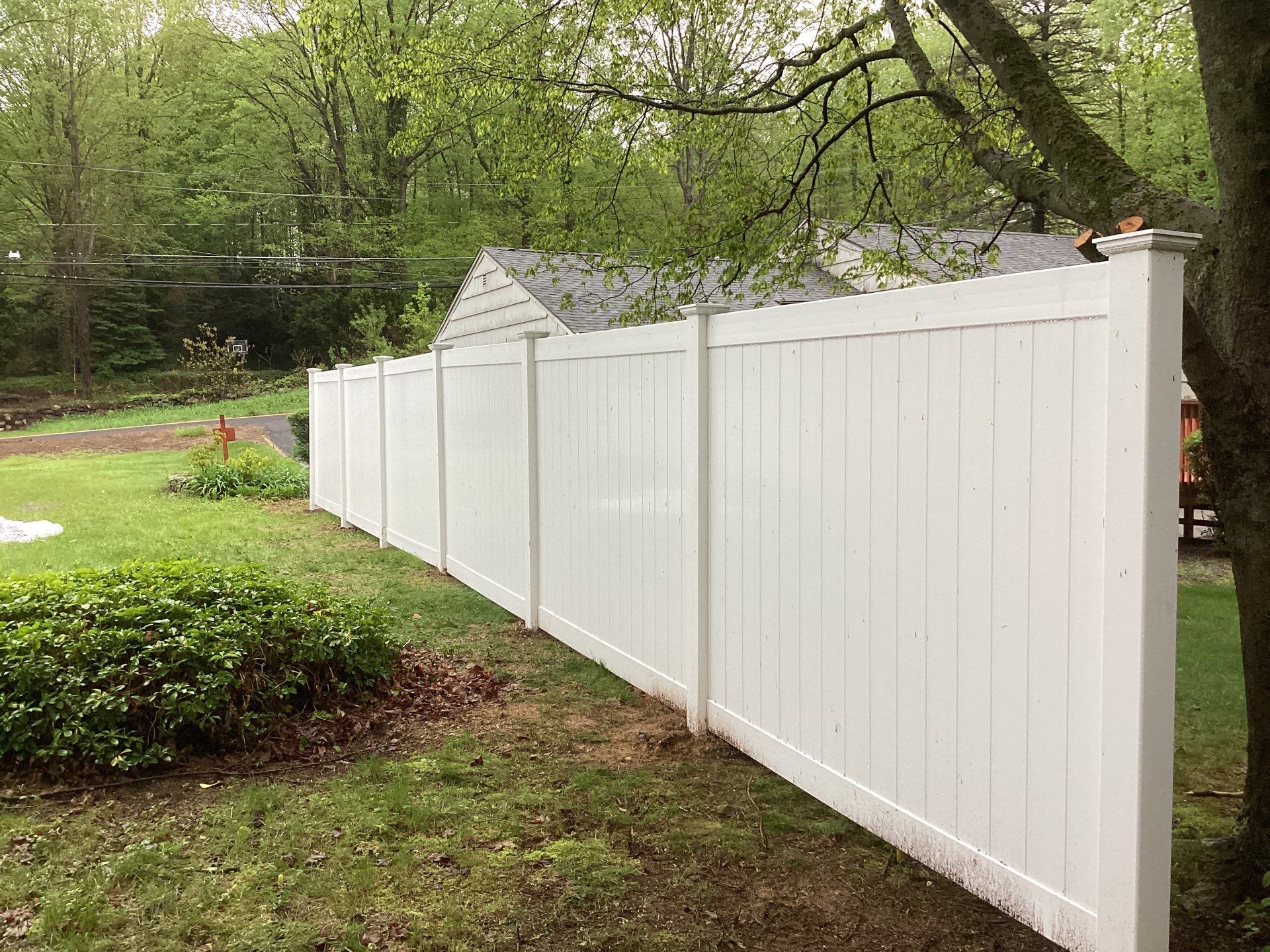 New White Vinyl privacy fence  by DiGiorgi Roofing and Siding Inc