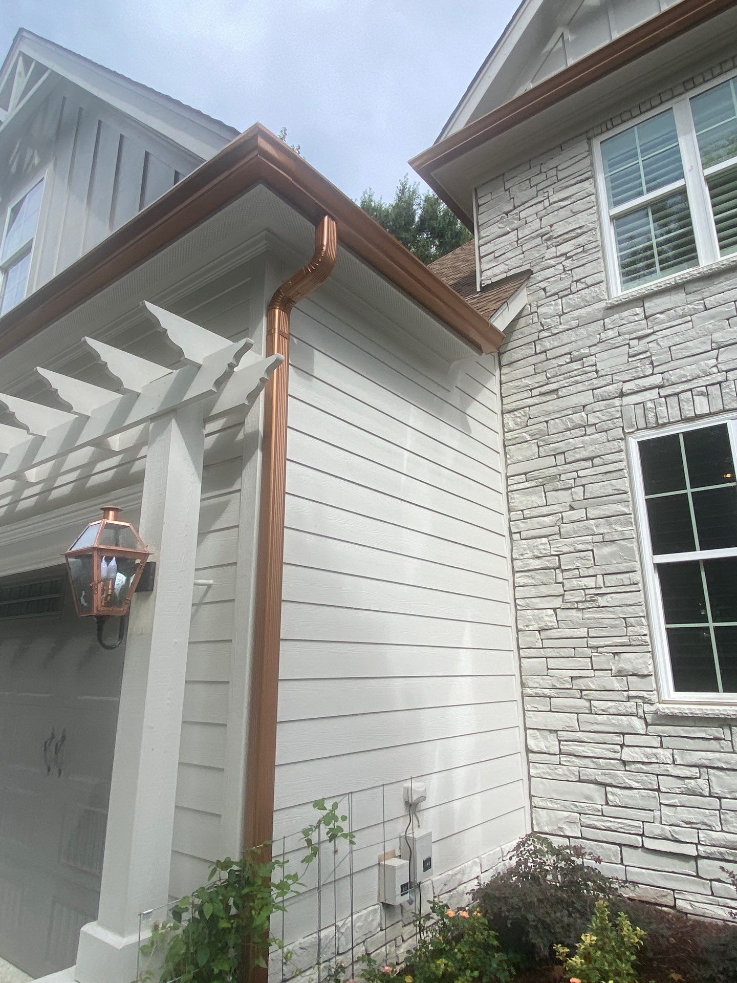 Roof Replacement - GAF Timberline HDZ Shakewood - 6” coppertone seamless gutters by Pro Performance Roofing