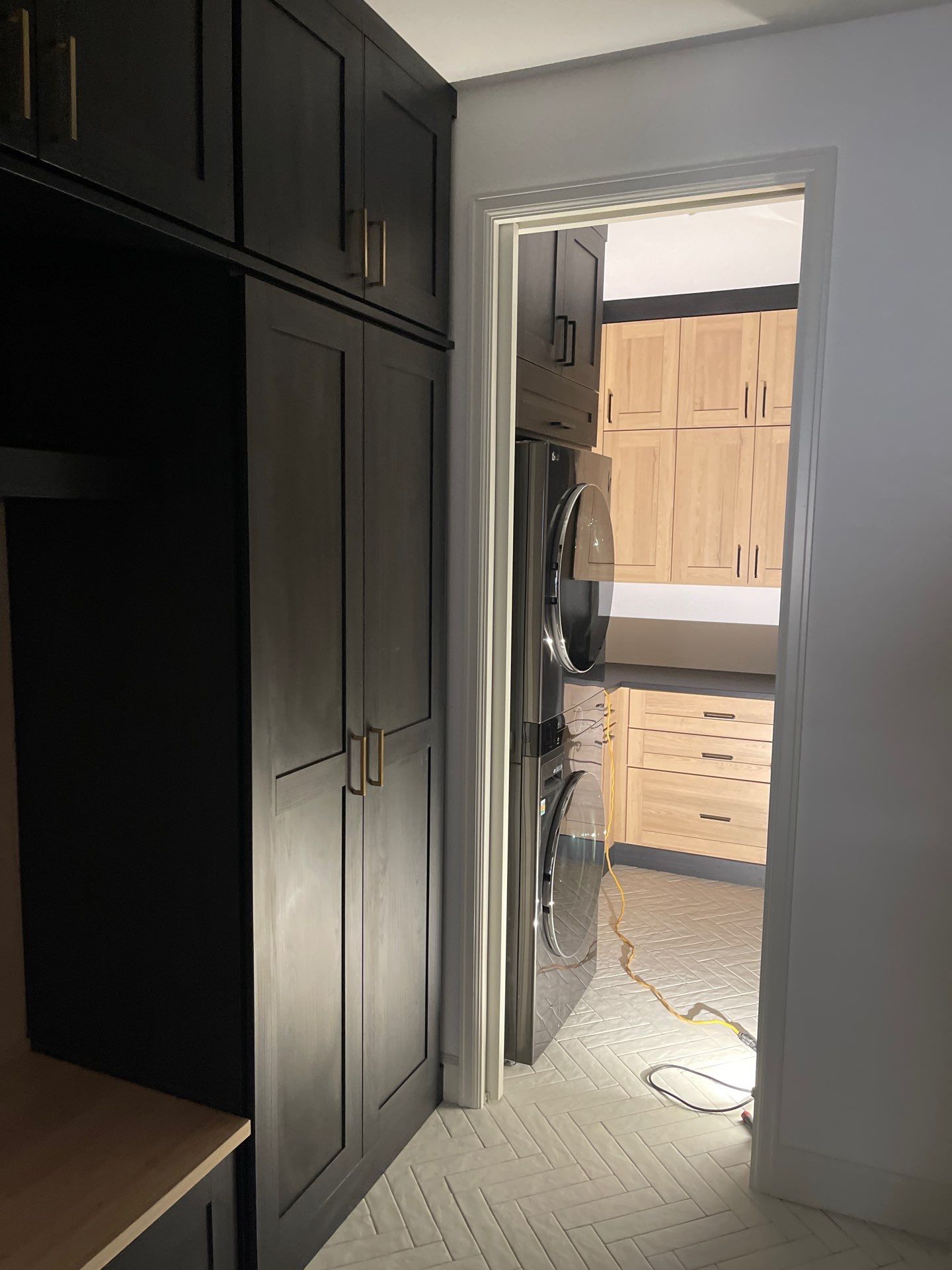 Two-Tone Closet with matching Mudroom + Laundry Room by Concept 32, Inc.