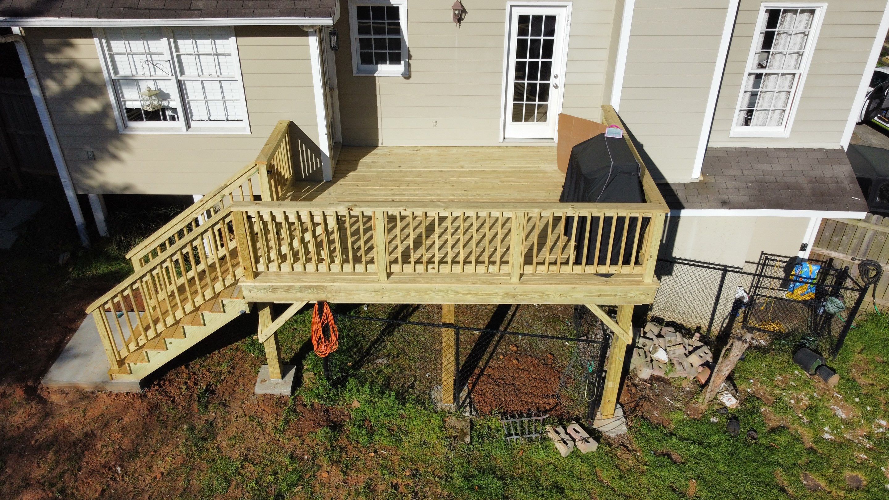 Elevated Pressure-Treated Wood Deck Replacement in Marietta by Swift Home Renovations