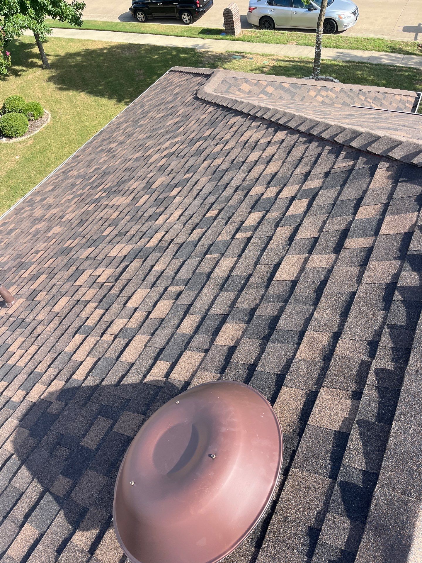 IKO Shadow Brown-Medium brown brick house by Tejas Roofworks + Restoration