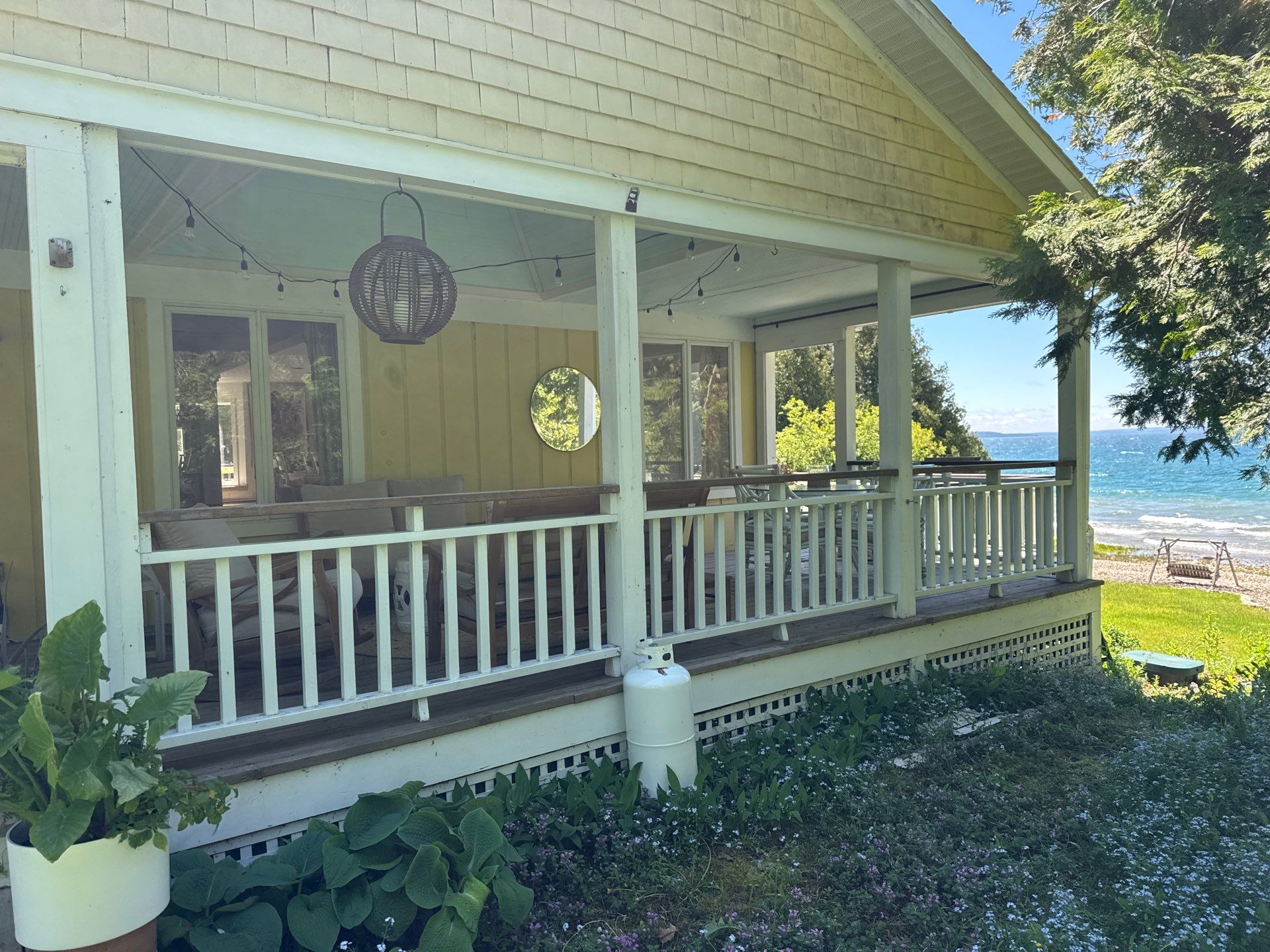 Sunesta motorized Sentry Privacy Screen Installation for Saint Ignace Waterfront Porch by Rainbow Seamless Systems