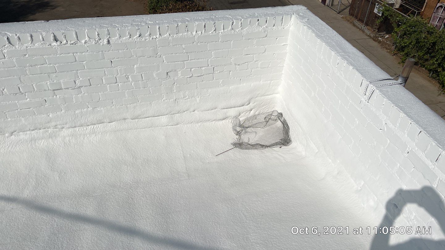 Polyurethane foam roof refurbish and recoating by Straight Edge Roofing Inc