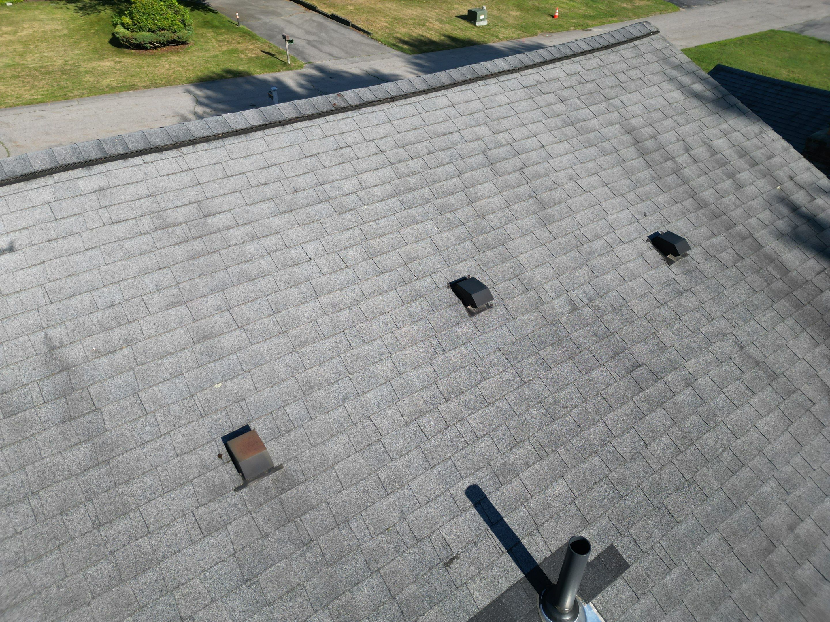 Complete Roof Replacement with Chimney Flashing, Gutter Guard System, and Vinyl Siding Repairs by Mighty Dog Roofing of Greater Middlesex County