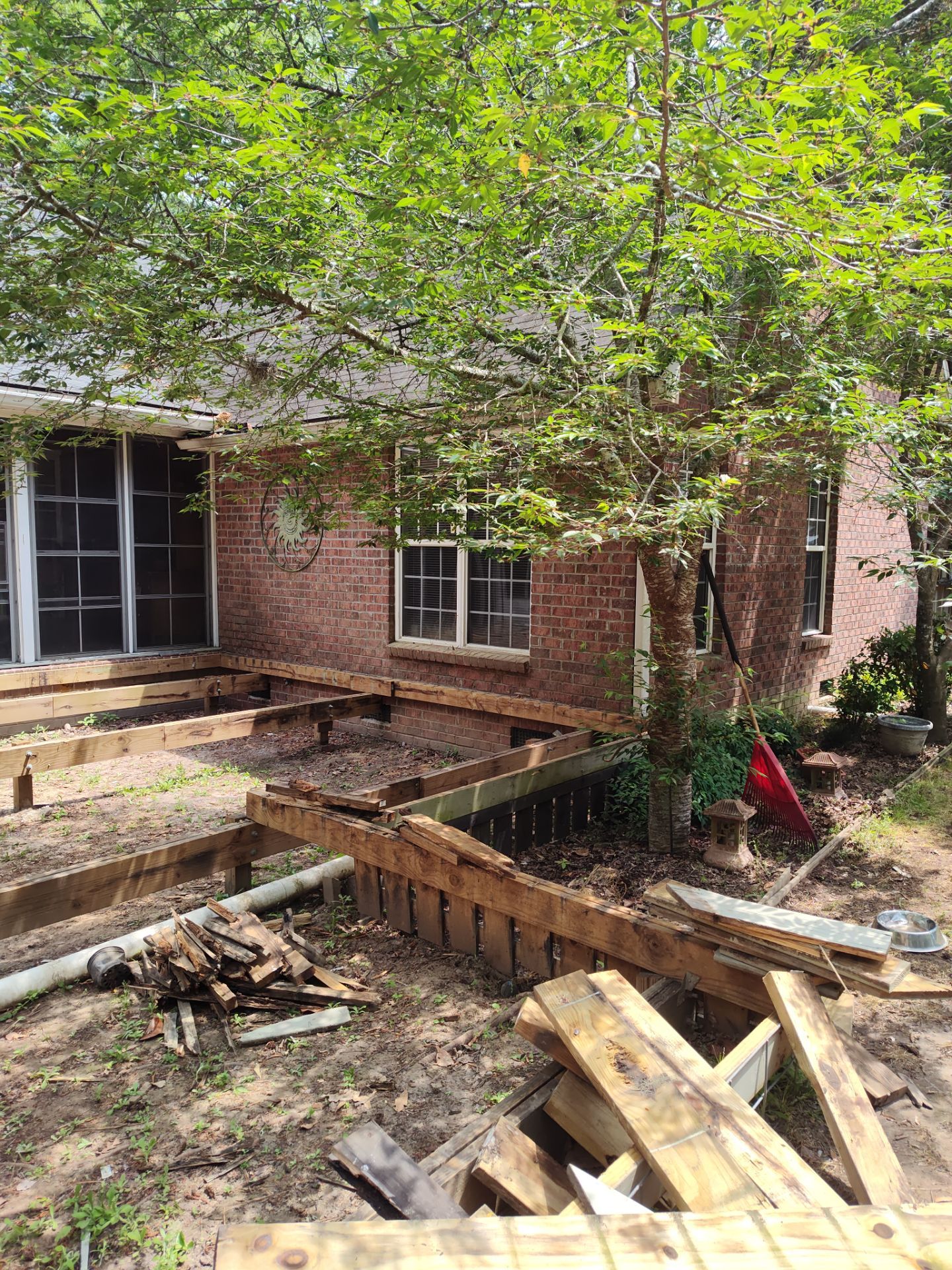 Patio in concrete with drainage improvements by Cornerstone Home Builders, LLC