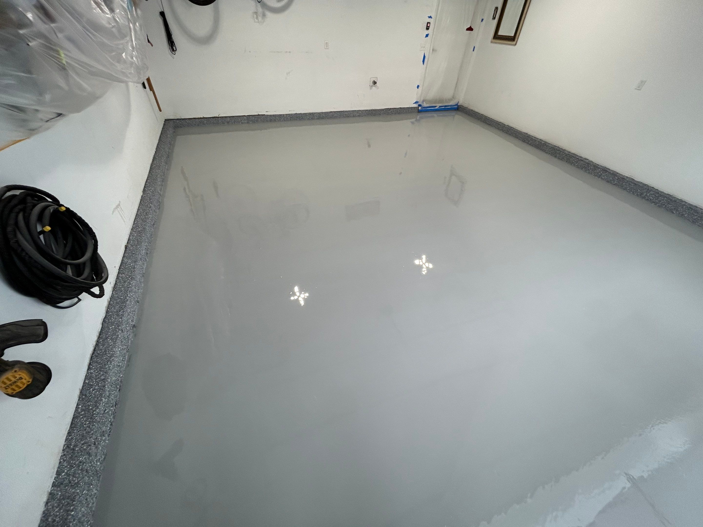 Garage Floor Coating Transformation by DiGiorgi Roofing and Siding Inc