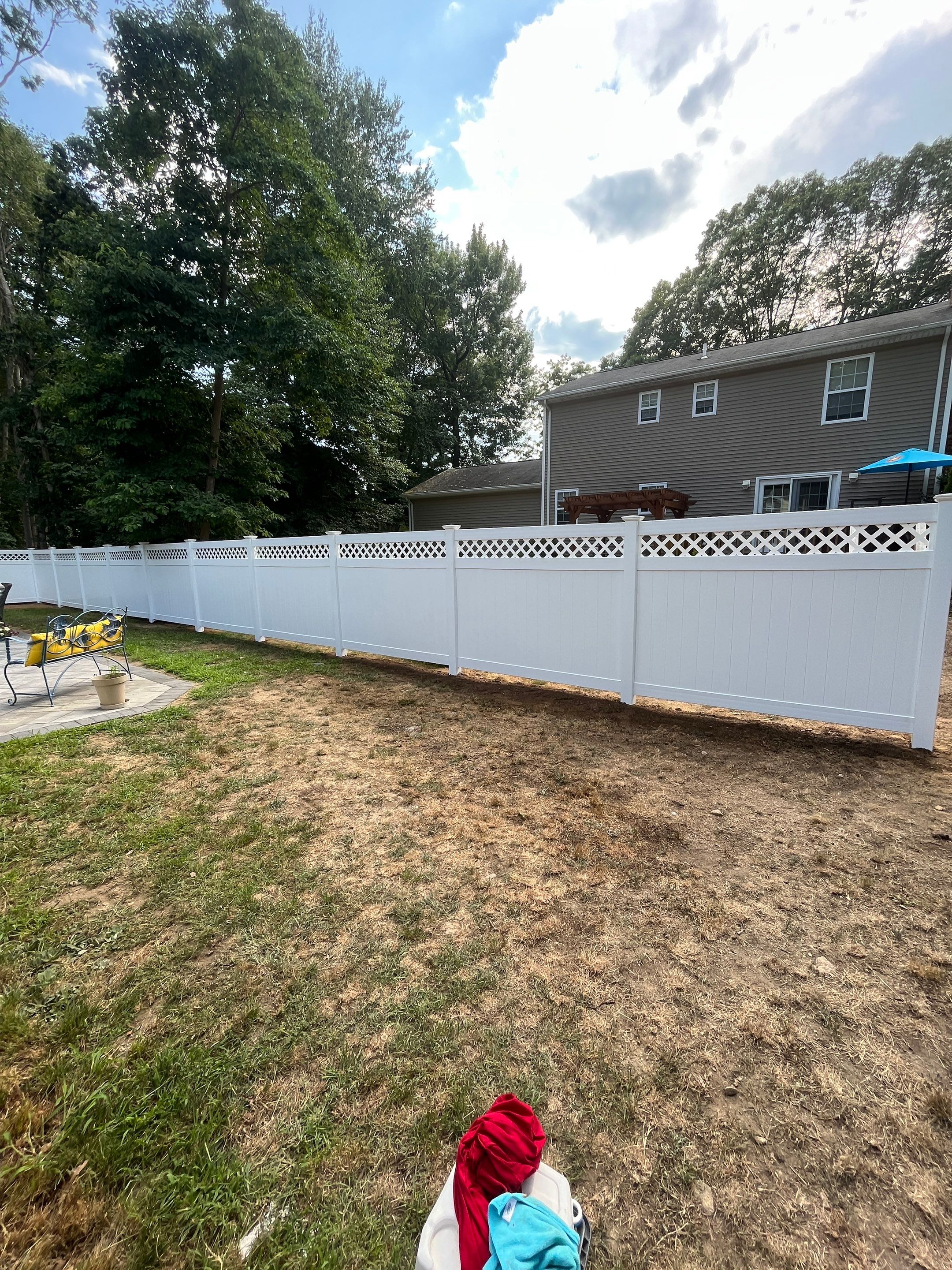 Vinyl privacy fence with Lattice top, White  by DiGiorgi Roofing and Siding Inc