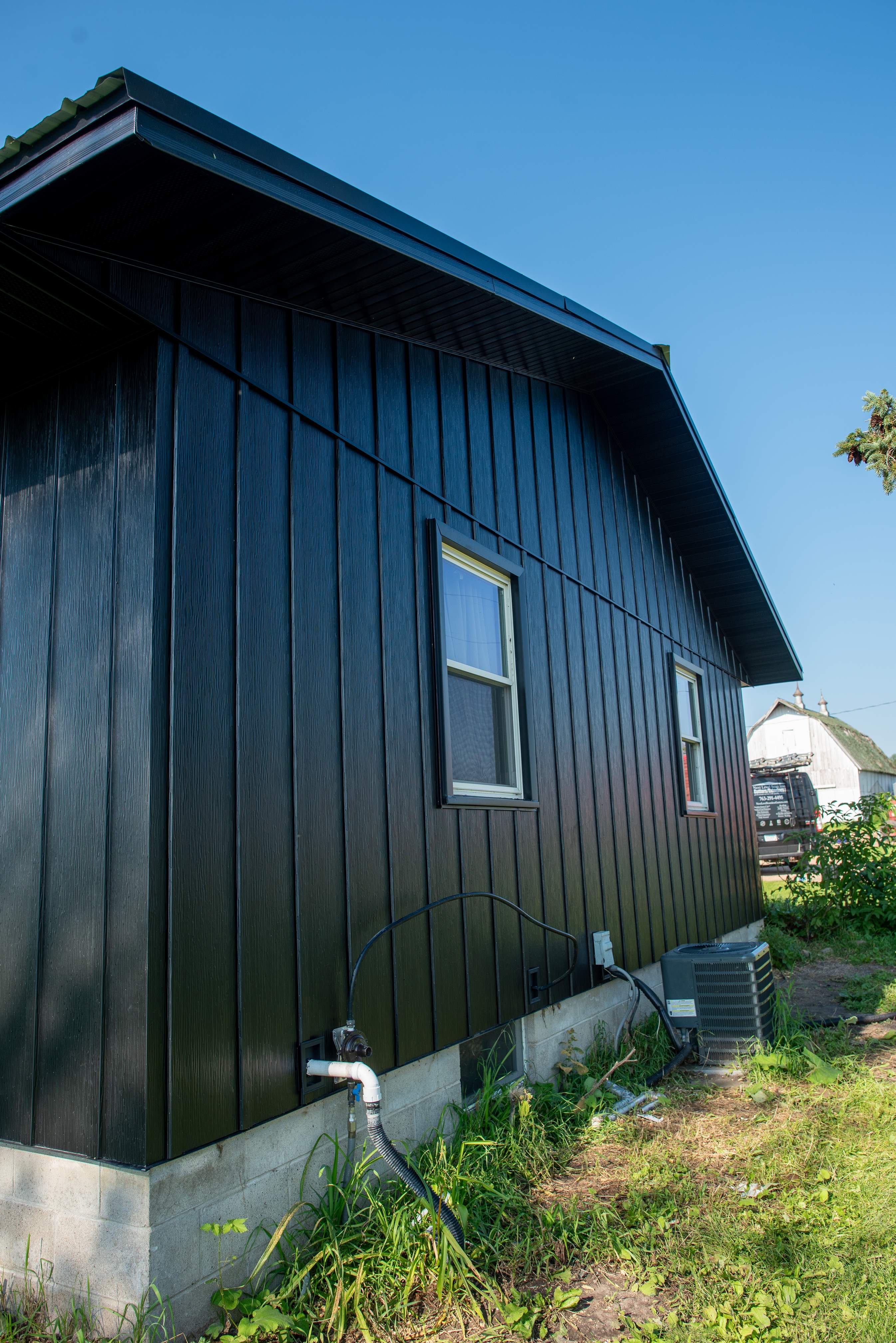 EDCO Steel Siding with Black Fascia & Soffit – Waverly, MN by Next Level Seamless Gutters / Exteriors Inc.