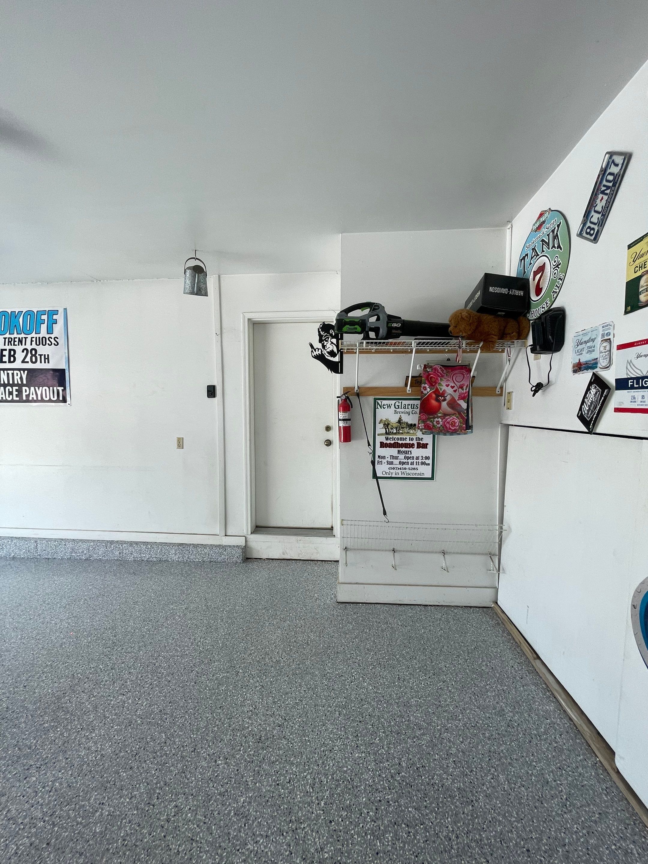 Residential Garage Floor Coating with Feather Grey Finish in Sioux Falls by Select Painting, Coatings & Garage Cabinets