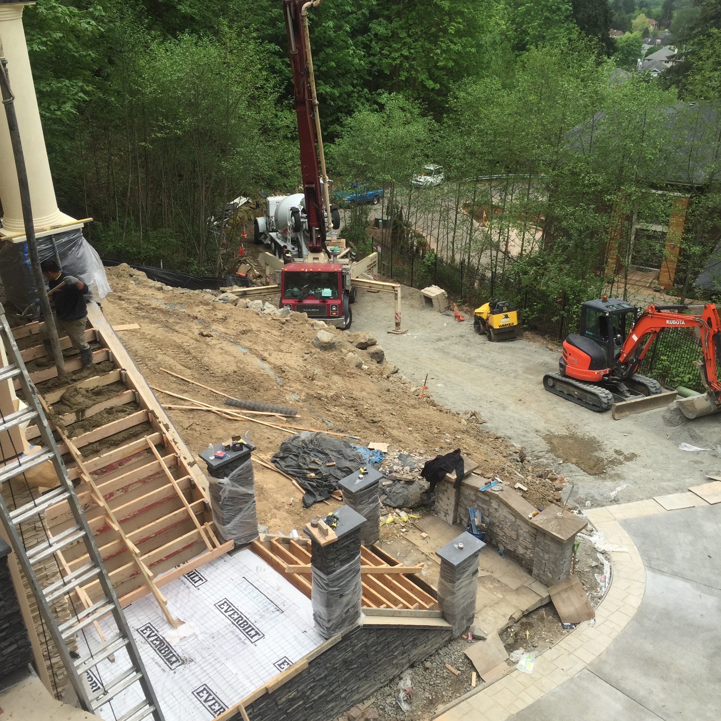 Asphalt Driveway and Stamped Concrete Patio Finish  by Jireh Asphalt & Concrete Inc 