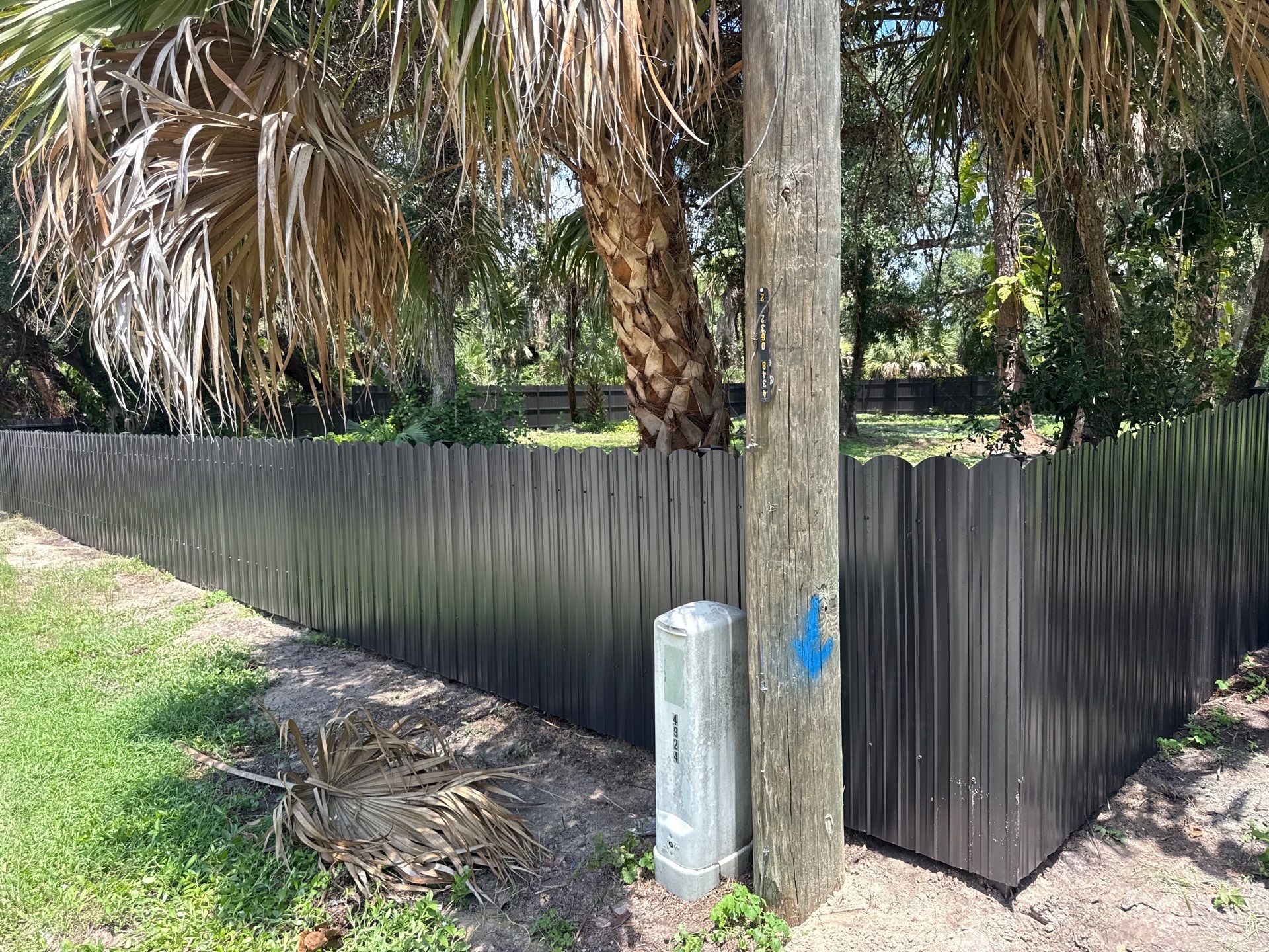 Bronze Scalloped Metal Privacy Fence Installation in North Port by True Fence LLC