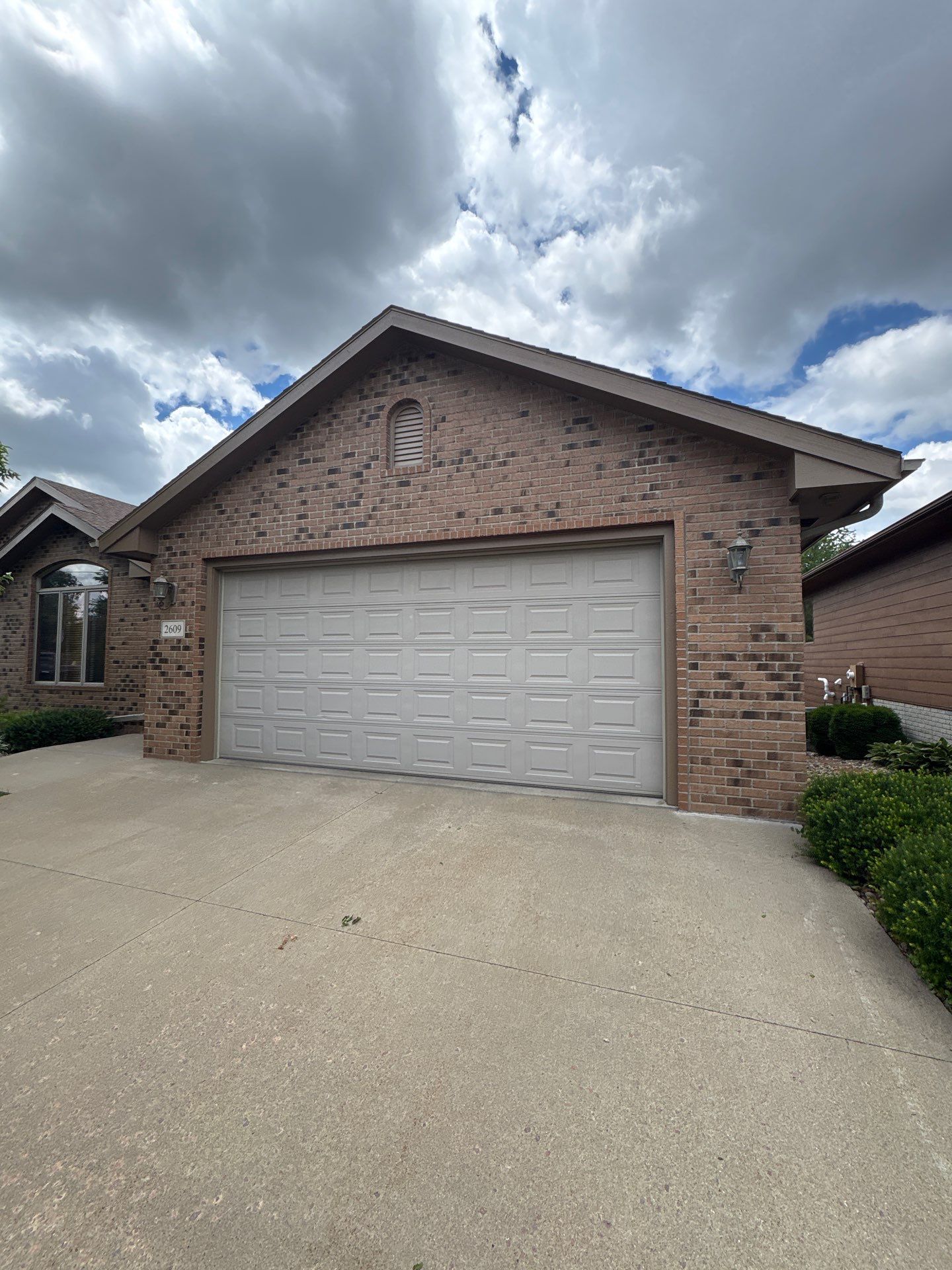 Multi-Story Residential Exterior Painting and Siding Refresh in Sioux Falls by Select Painting, Coatings & Garage Cabinets