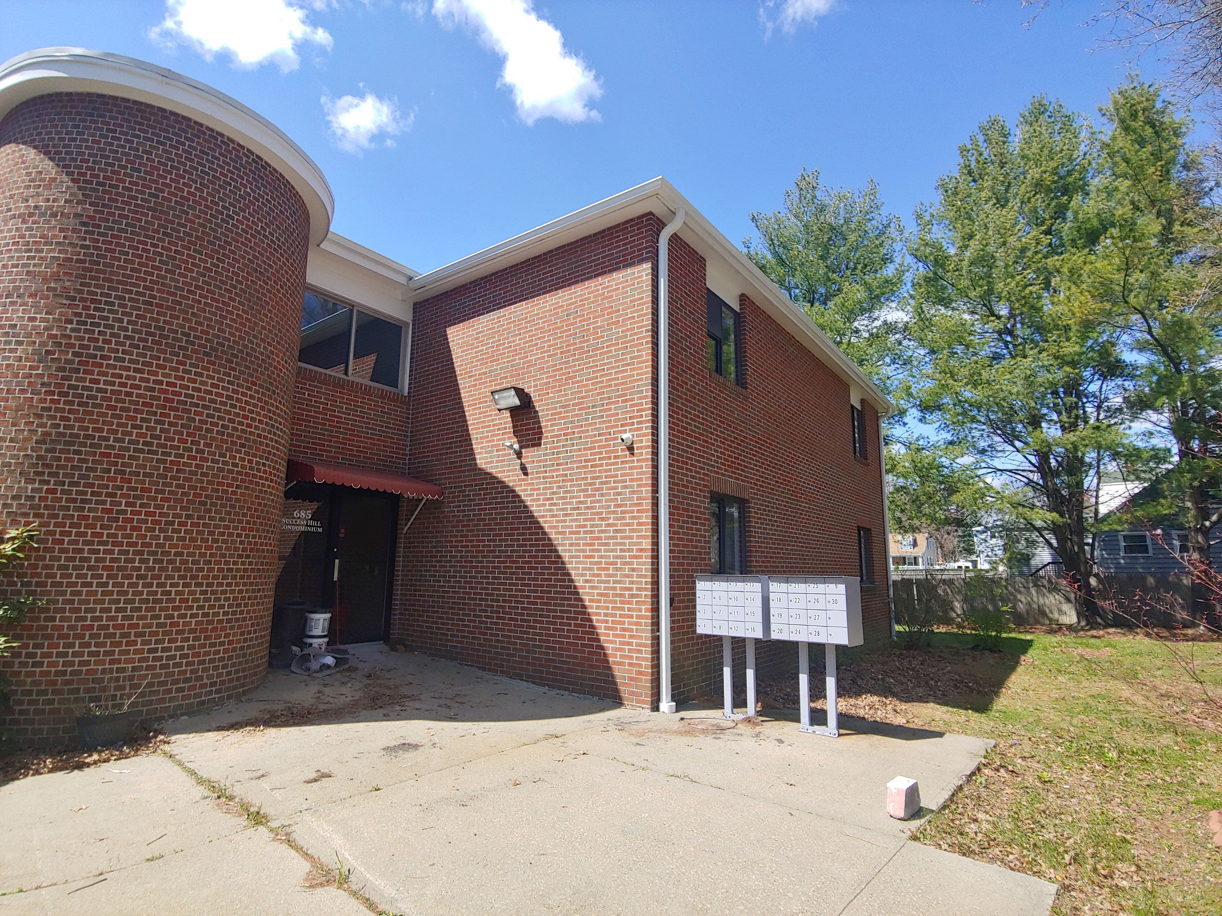 Commercial Roofing Installation using EPDM with white gutters by A Plus Exterior