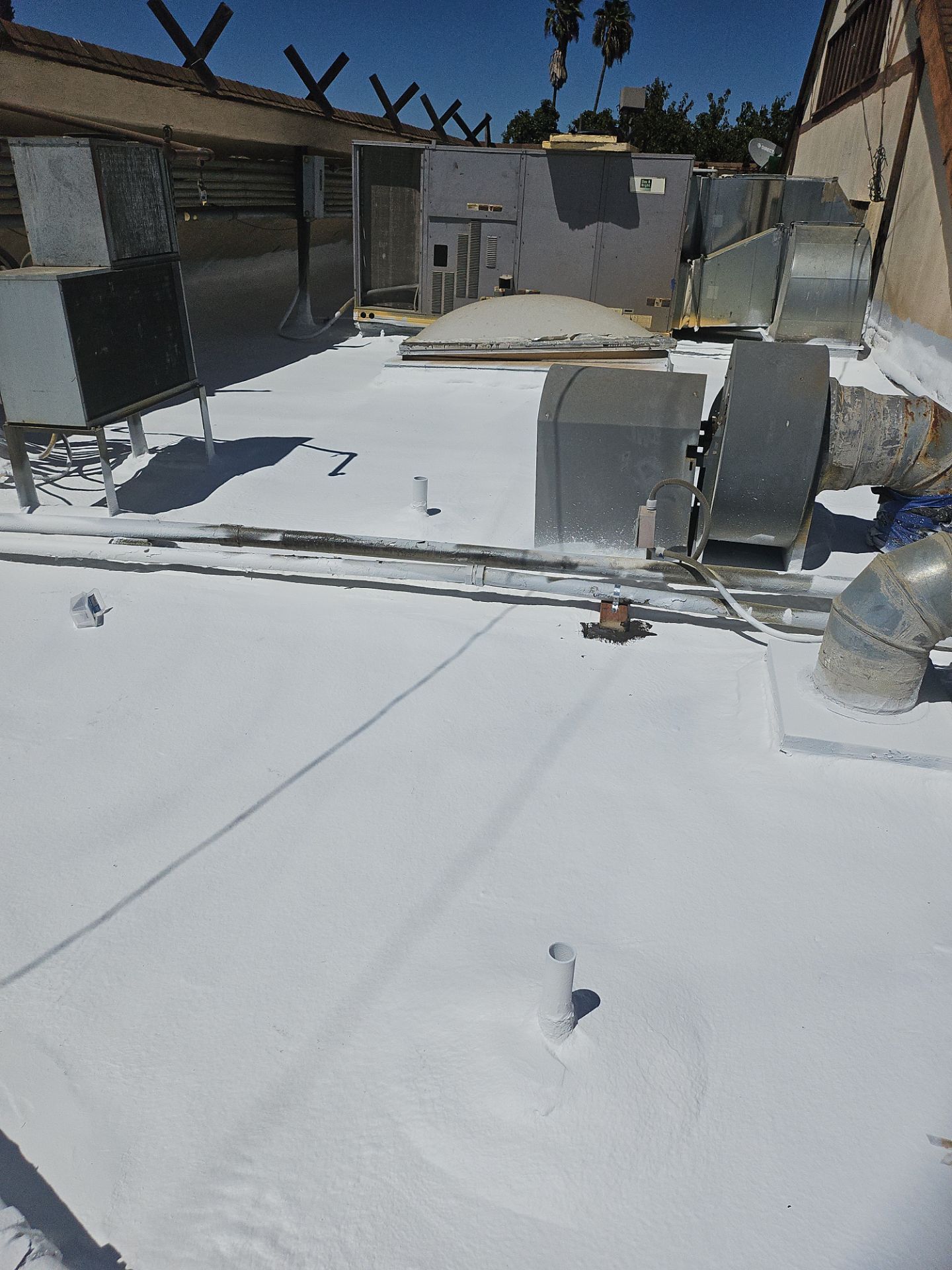 Spray foam and coatings using General Coatings acrylic coatings and spray foam by Straight Edge Roofing Inc