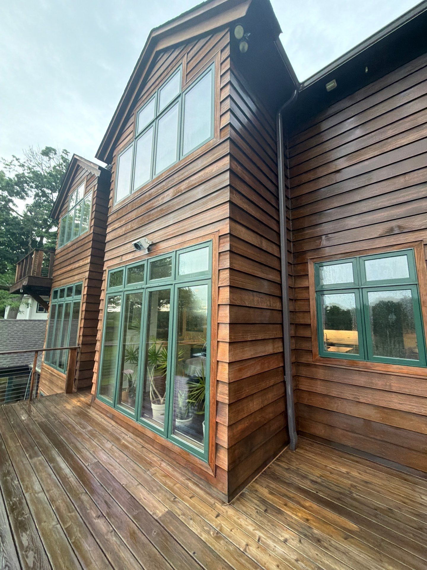 Exterior Powerwashing and Maintenance for a Teaneck Timber Home by Spectrum Painting, LLC