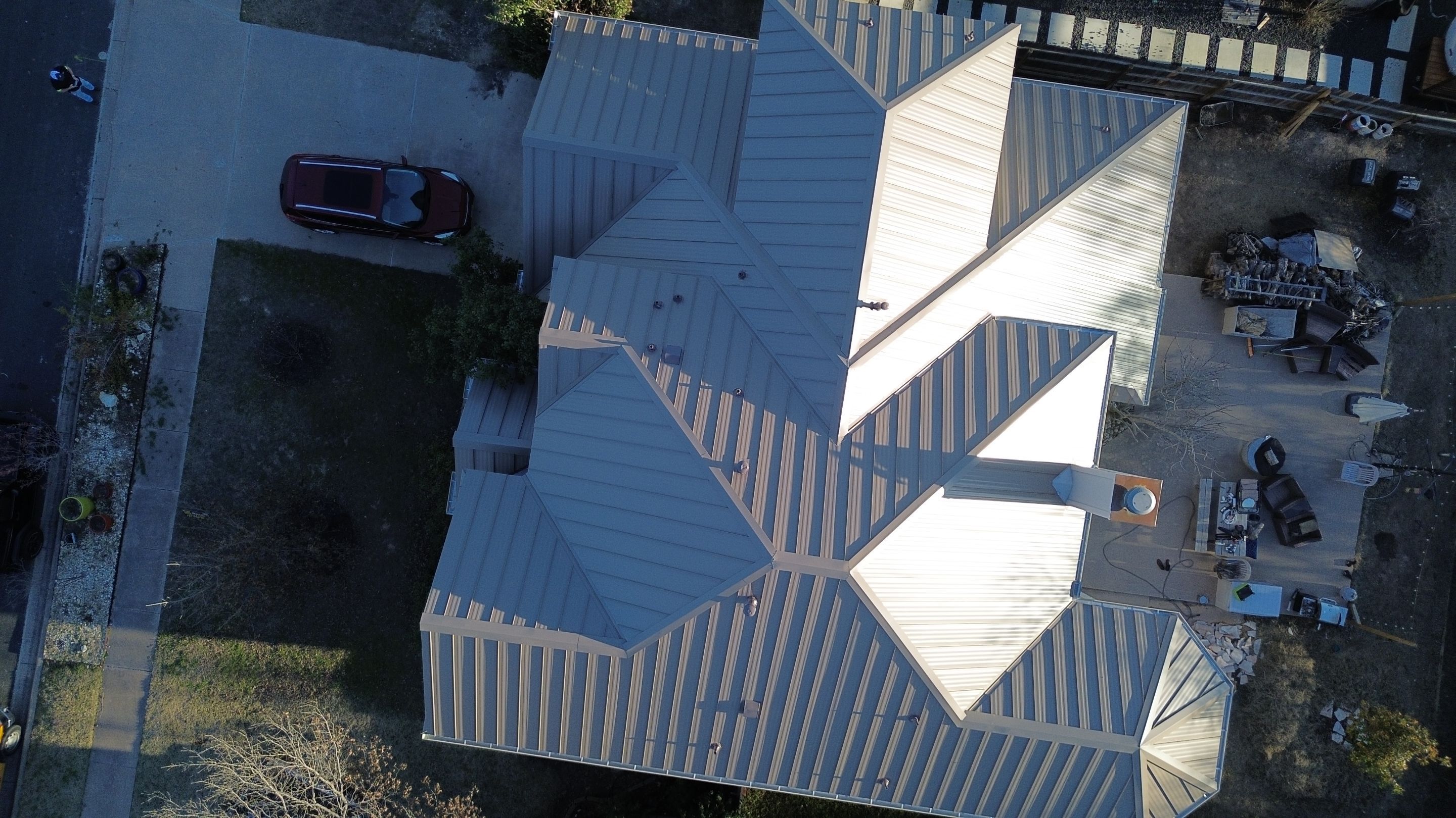 Three Tab Shingles To Metal Standing Seam by DeZign Roofing & Exteriors