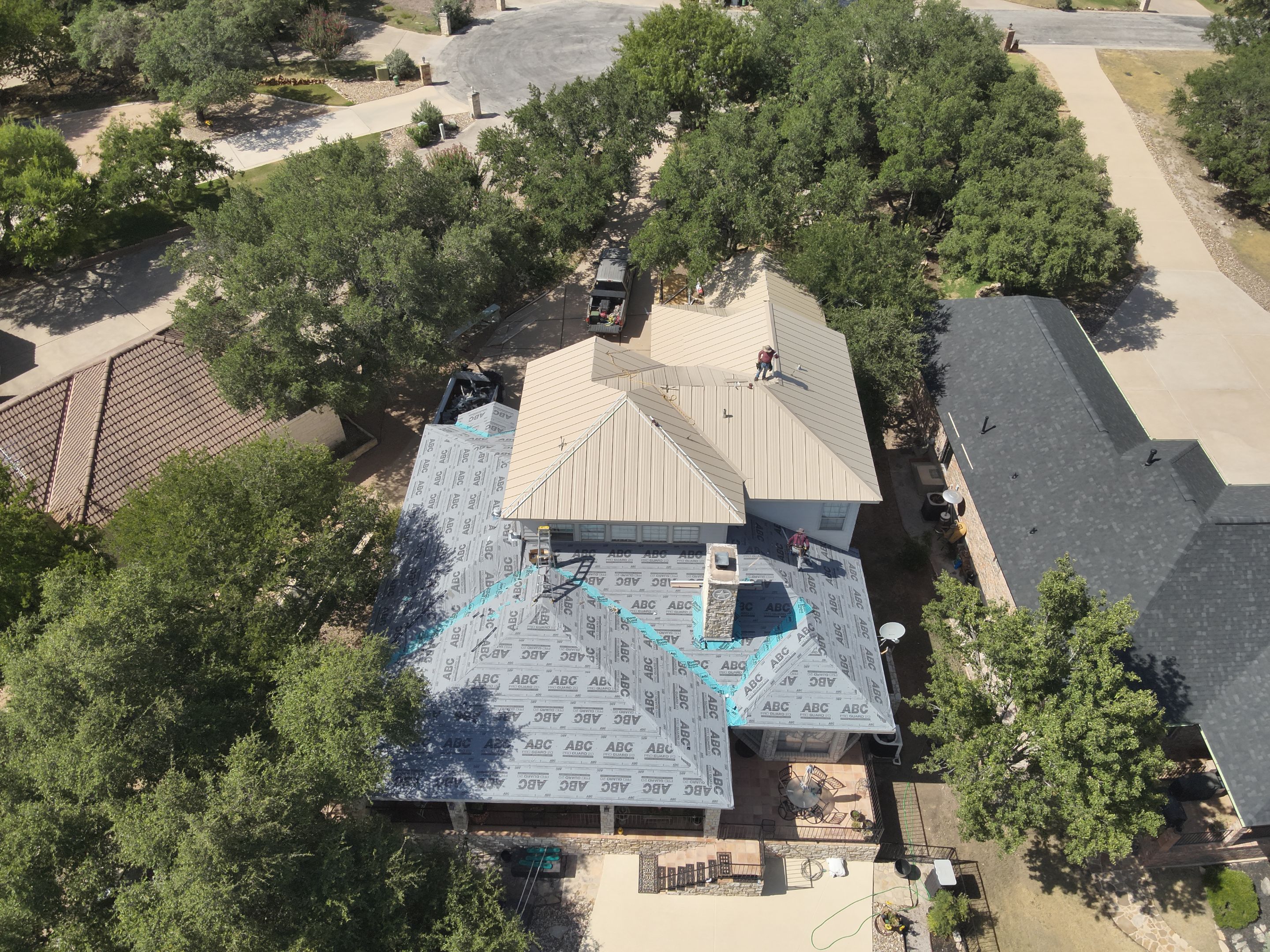 Residential Roof Replacement using 24 GA Double-Lock - Surrey Beige by Action Exteriors Austin