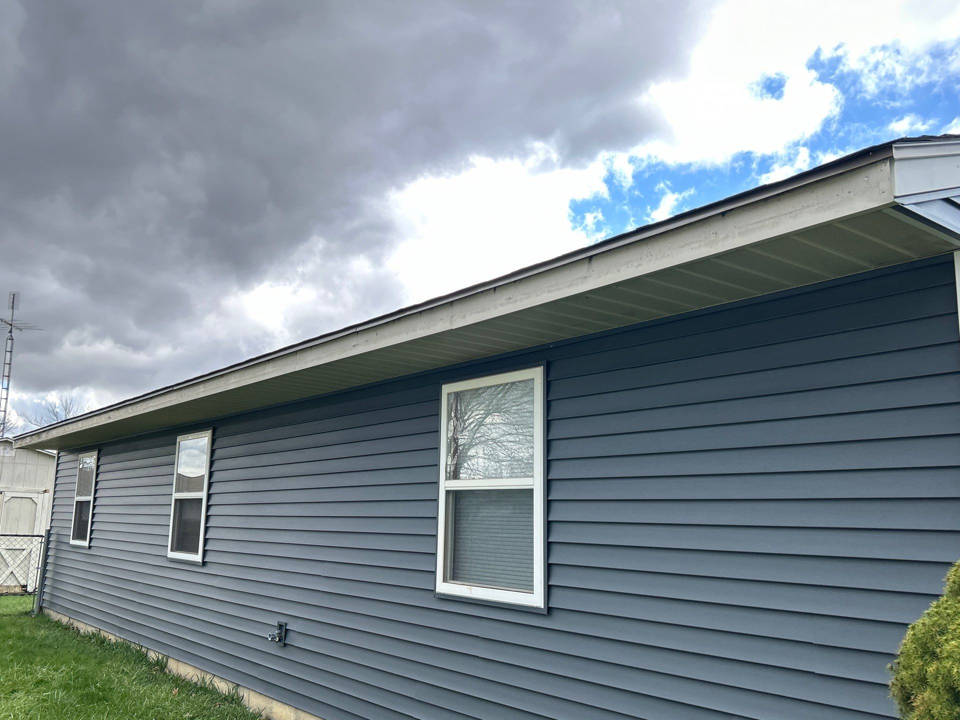Storm Damage Residential Roof and Siding Installation by WIW Enterprises Inc