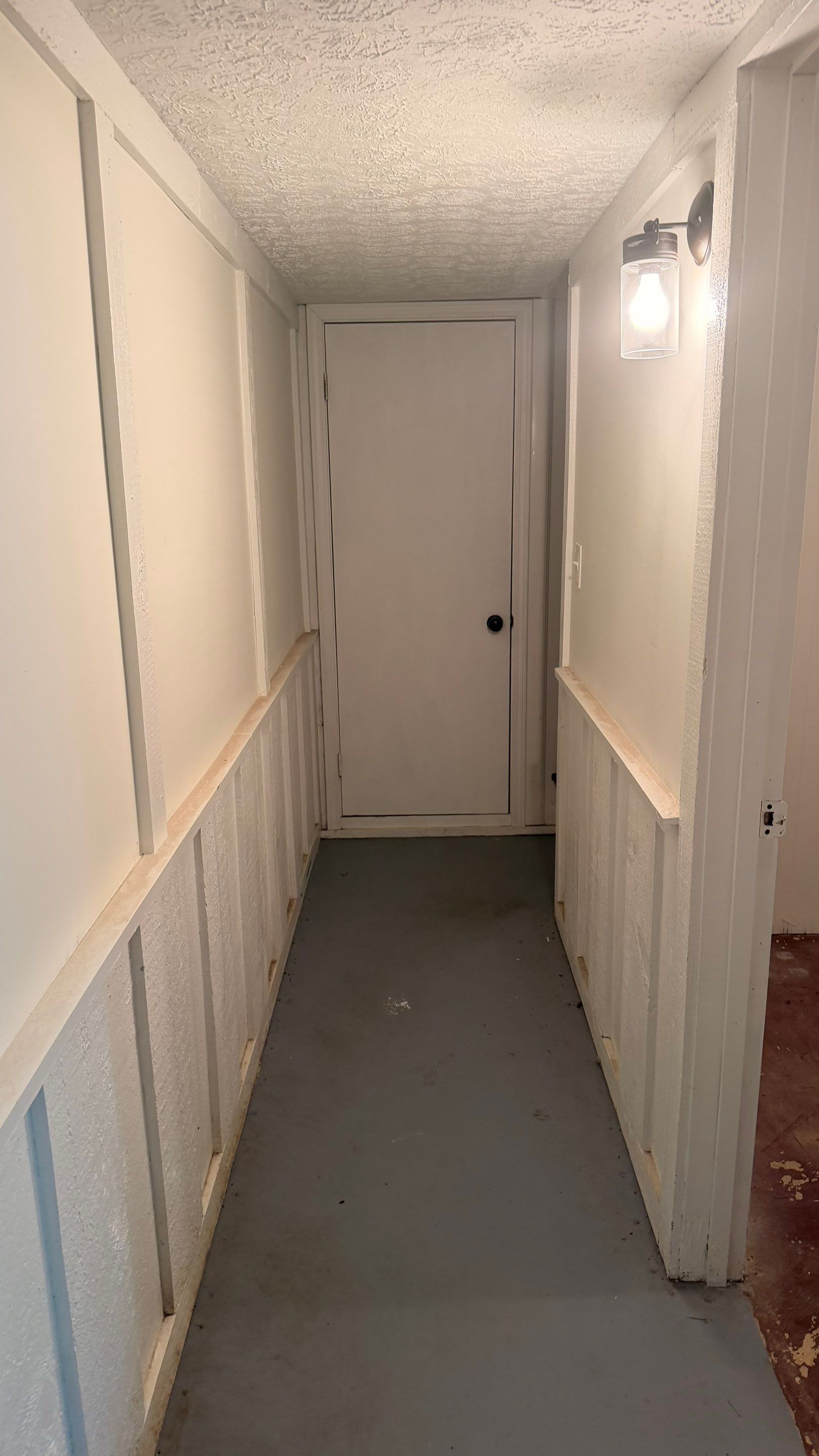 Basement Remodeling with Wood-Look Flooring and Custom Wainscoting in Dunwoody by Swift Home Renovations