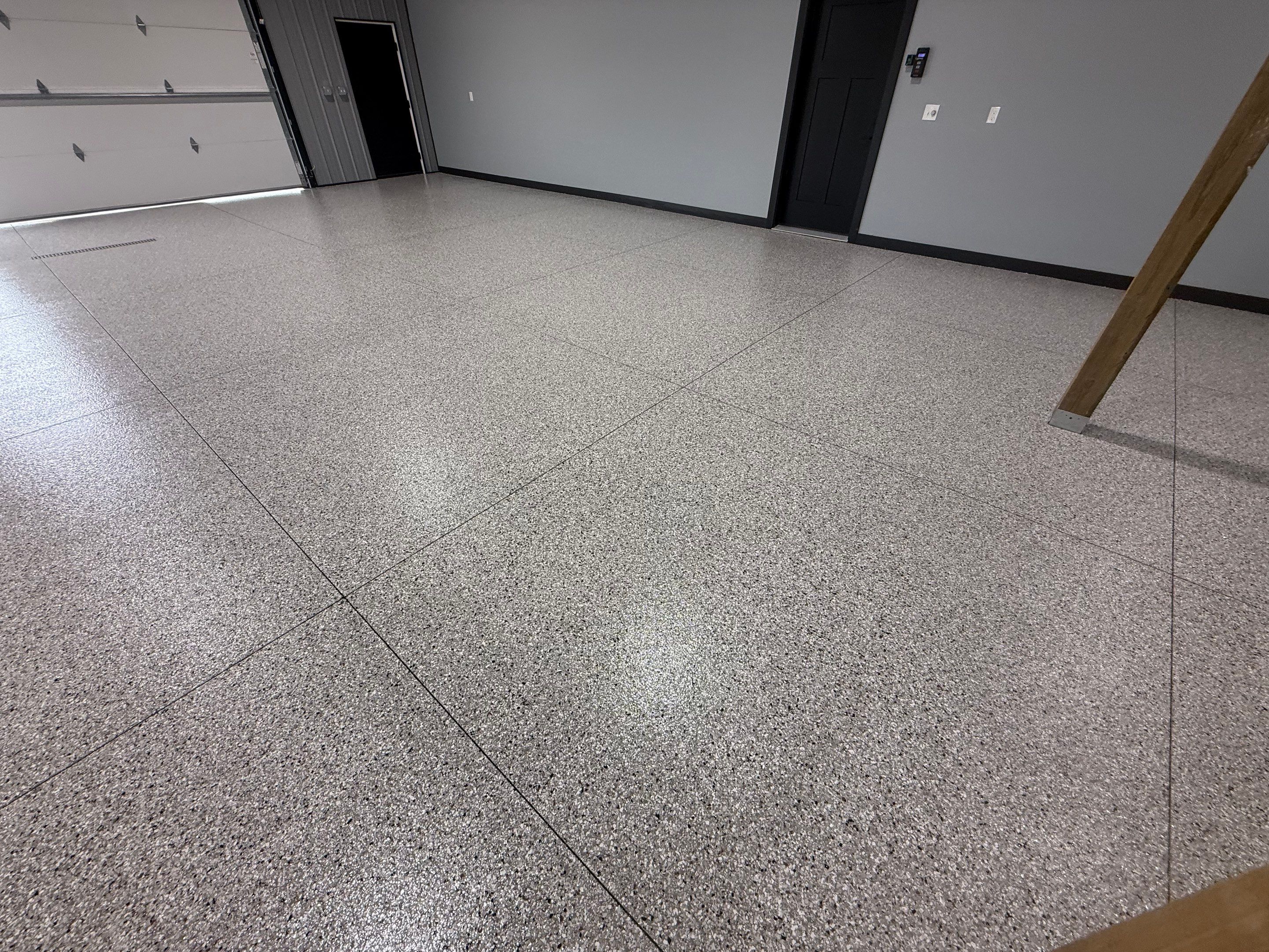 Polyaspartic Garage Floor Coating with Decorative Flake in Wentworth by Select Painting, Coatings & Garage Cabinets