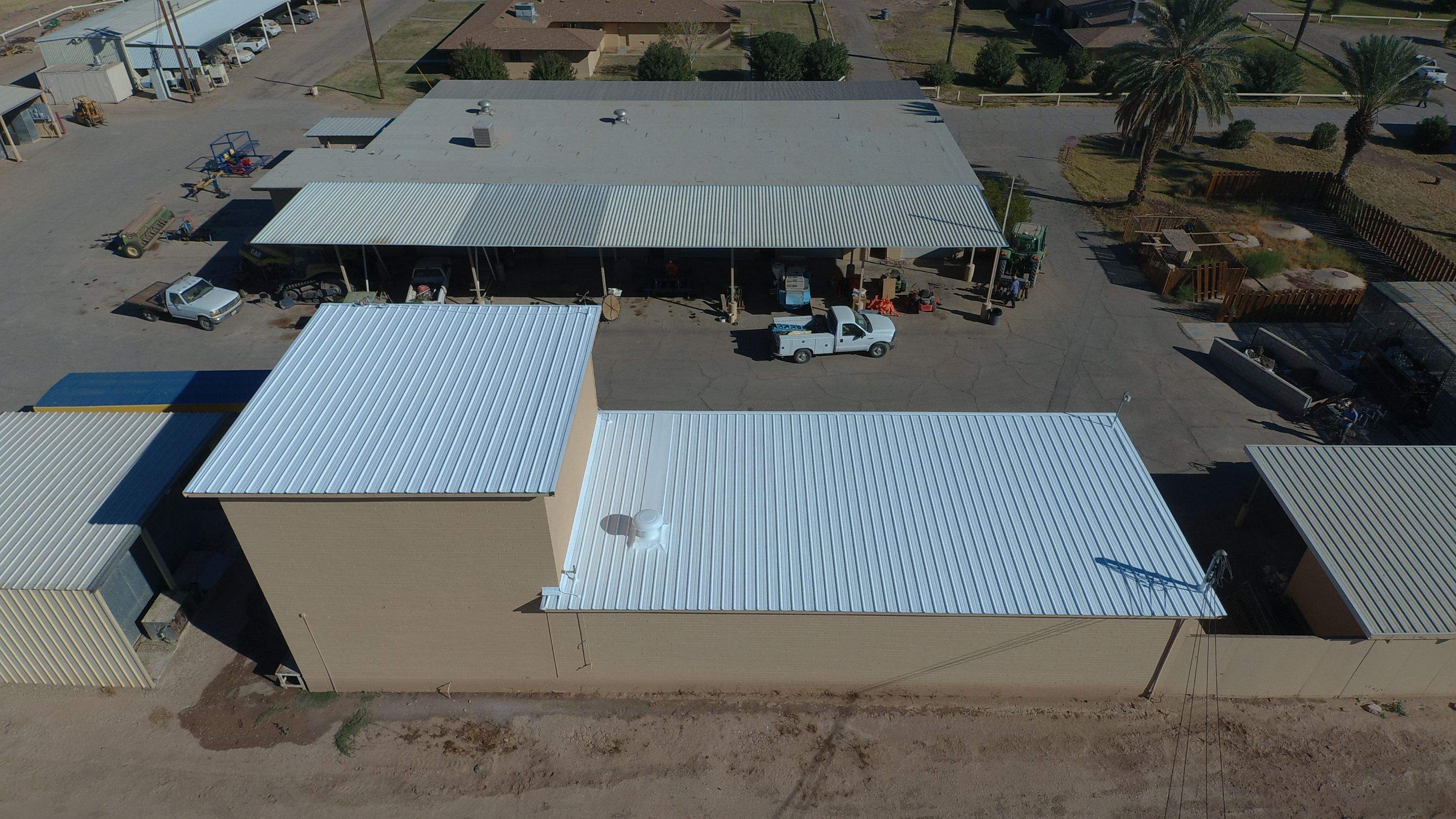 Metal roof restoration on commercial roof using Conklin Benchmark/PUMA XL fabric and coating by Straight Edge Roofing Inc