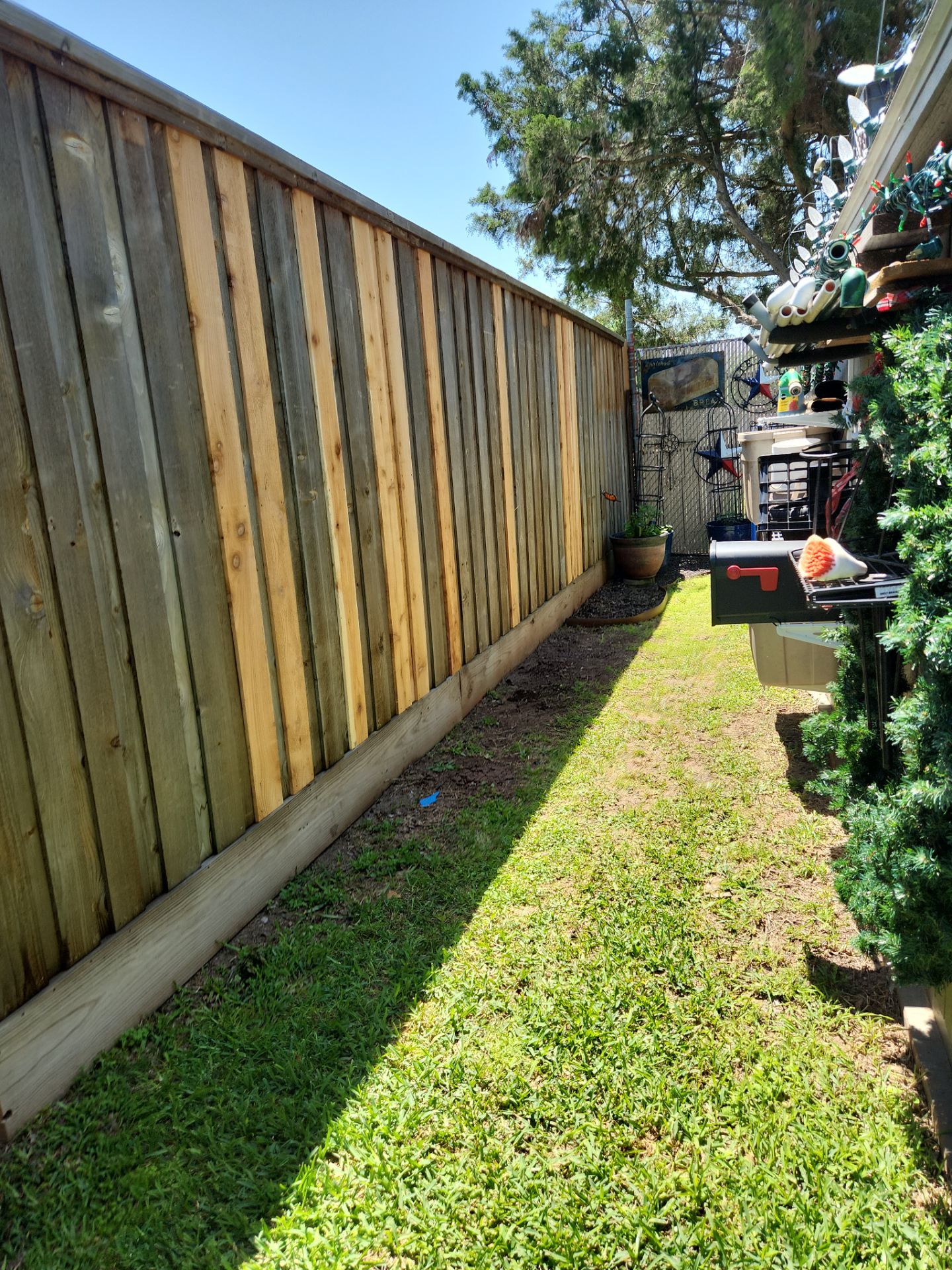 Modern Black Fence Finish by Tim's Fences