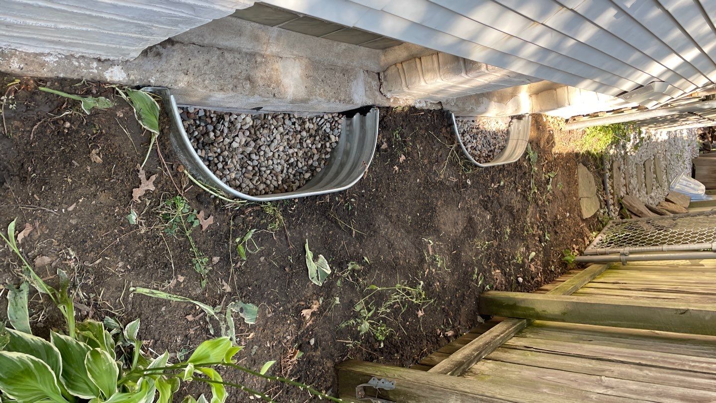 Drain Tile, Window Wells & Buried Discharge in Minneapolis by Waterproofing Northeast