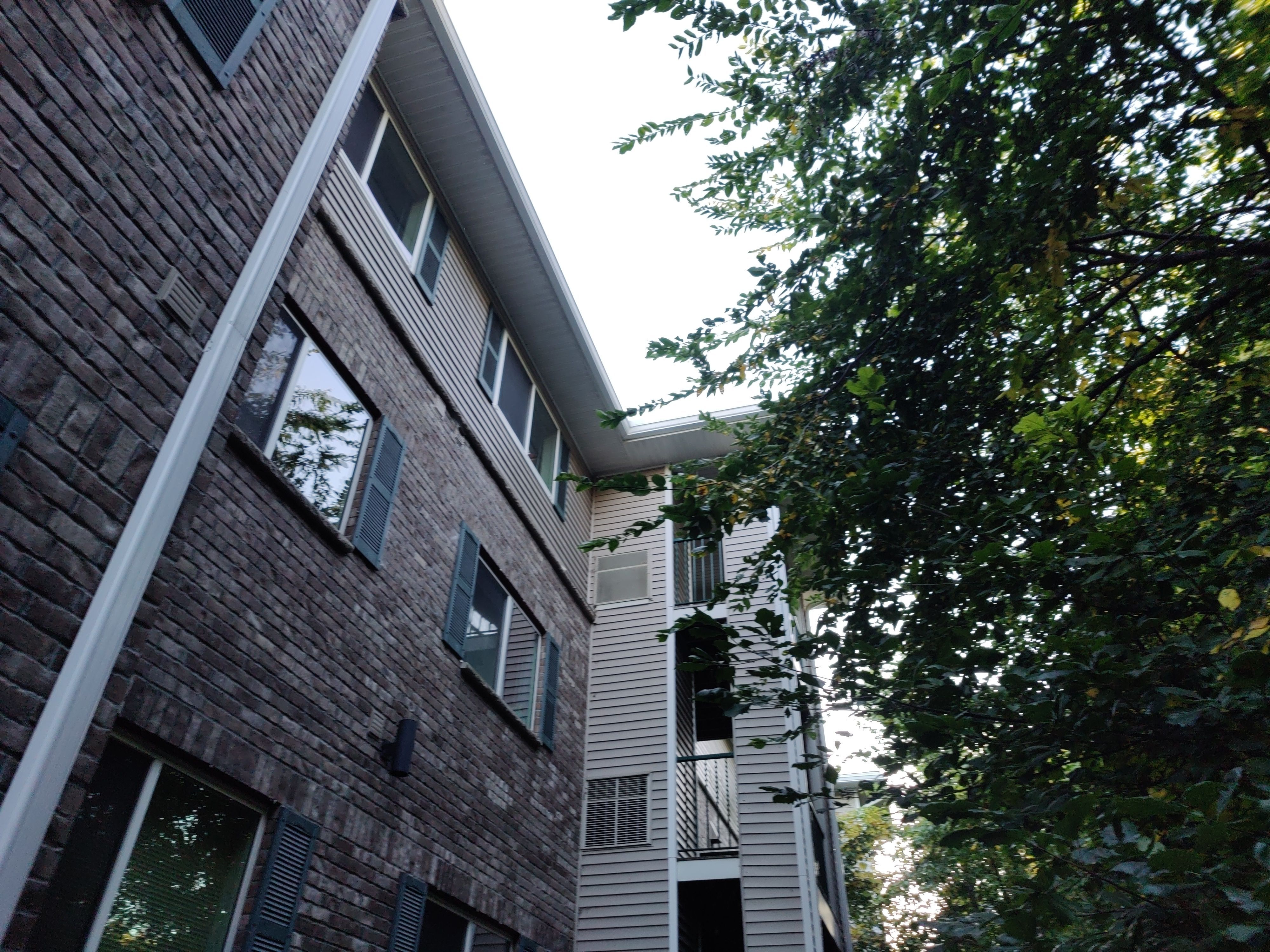 6" White Seamless gutters on Apartment Building- Prior Lake, MN by Next Level Seamless Gutters / Exteriors Inc.