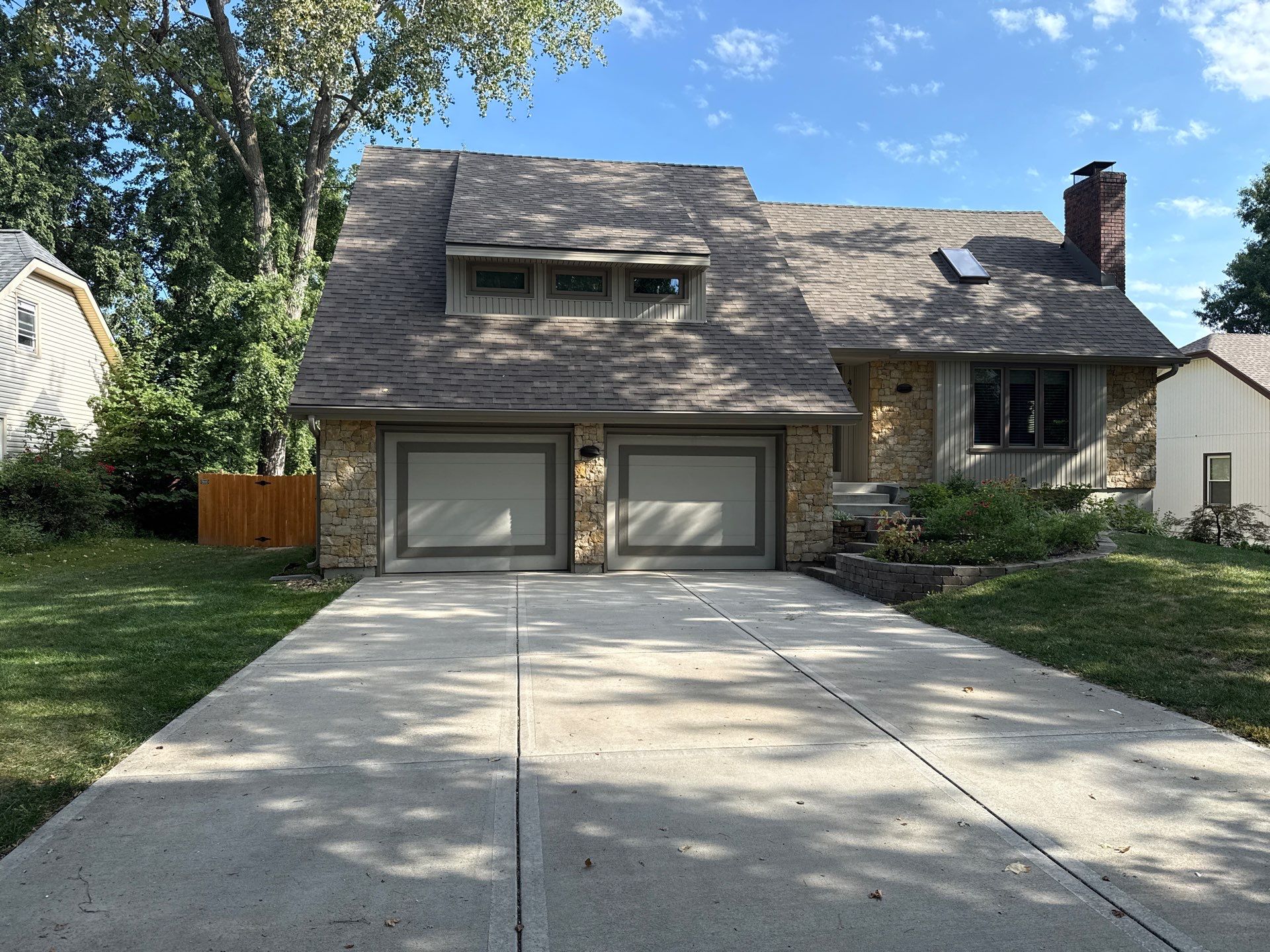 Comprehensive Kansas City Exterior Remodel Featuring Board And Batten Siding by EEC Windows, Siding & Roofing