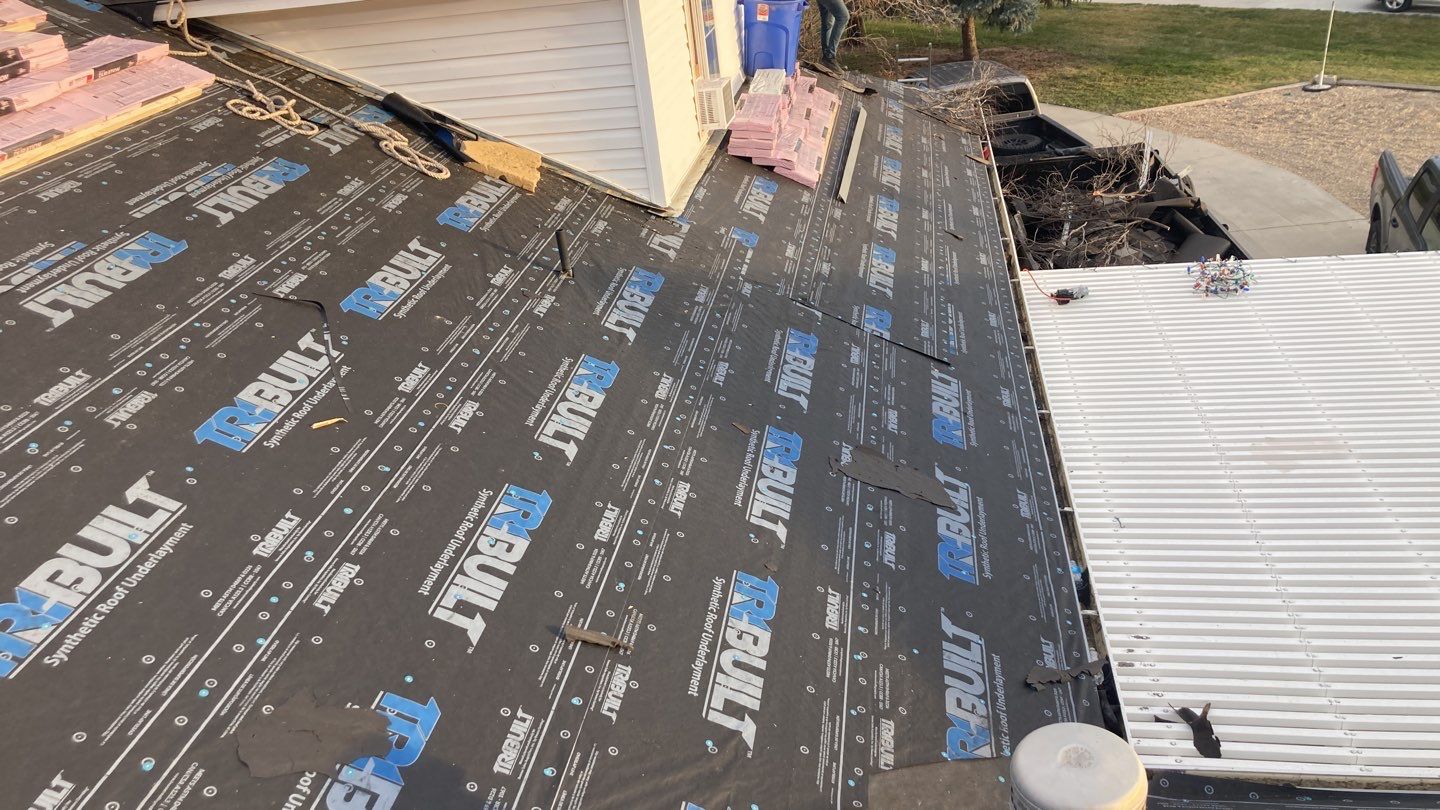 Two story farmhouse style roofing installation using Owens Corning Duration in the color Teak by ID Roofing LLC