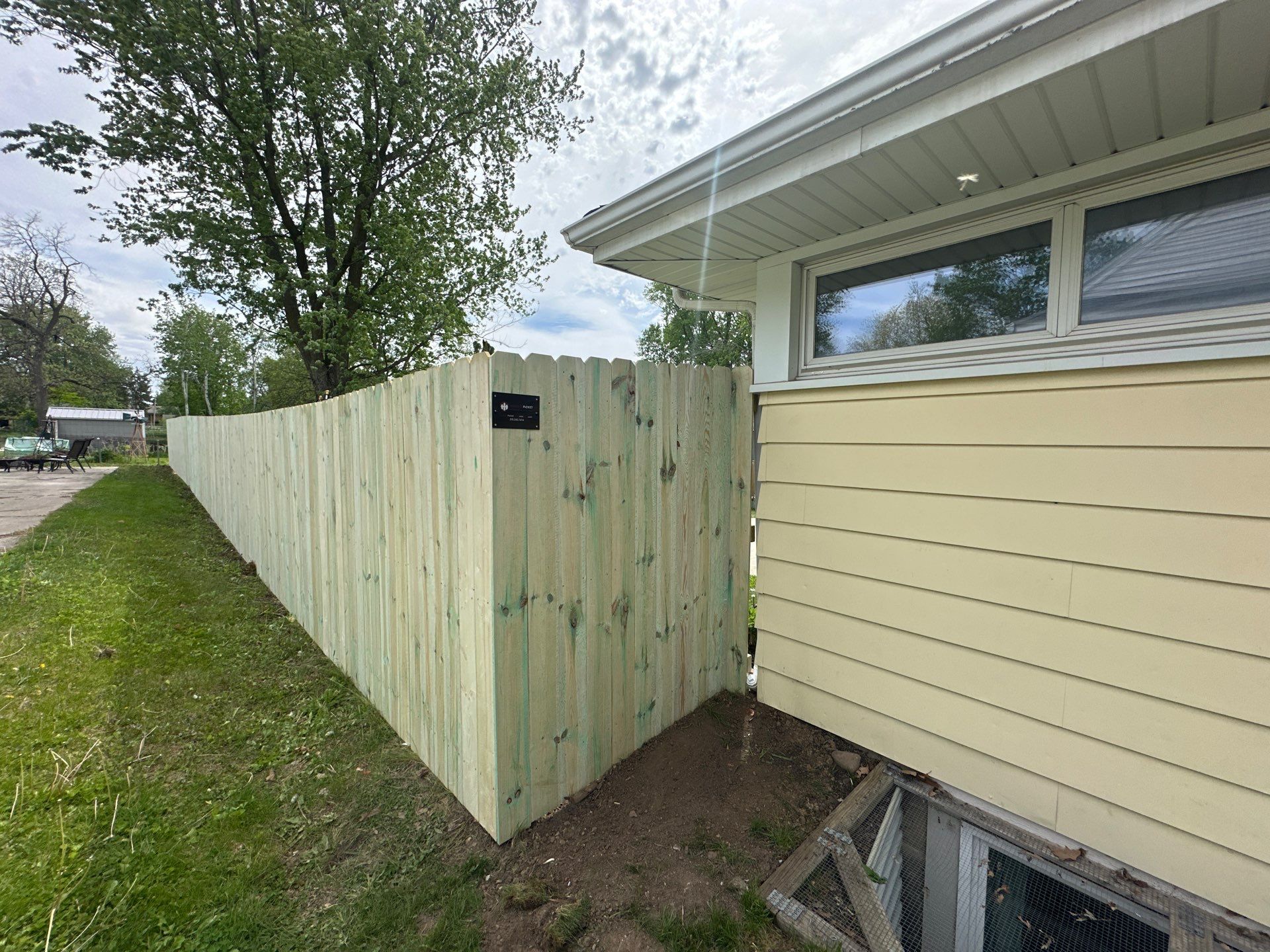 Pressure-Treated Wood Privacy Fence Installation in Waterloo by Perfect Picket Fence and Stain