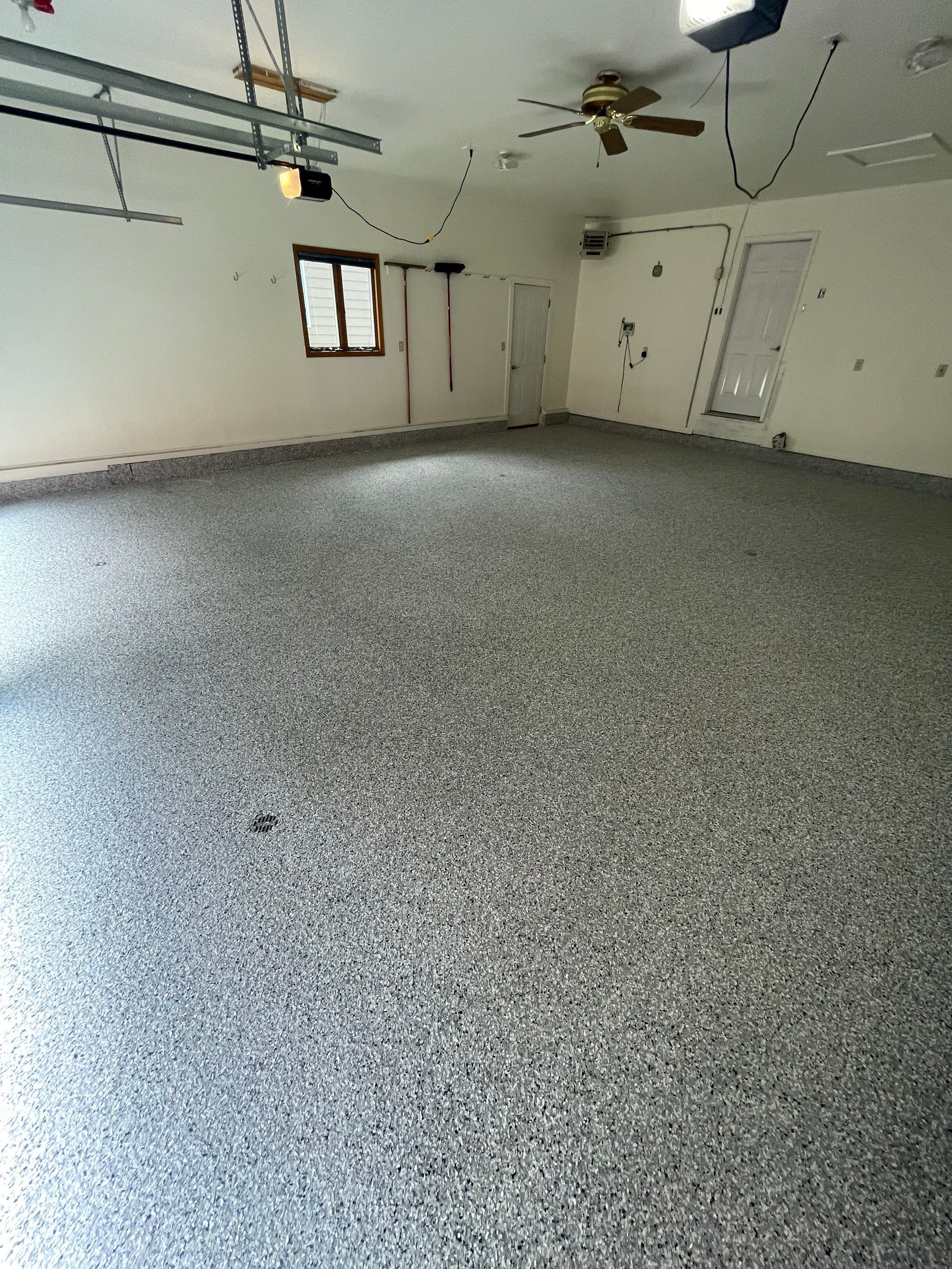 Madison Garage Concrete Coating with Feather Grey Speckle Finish by Select Painting, Coatings & Garage Cabinets