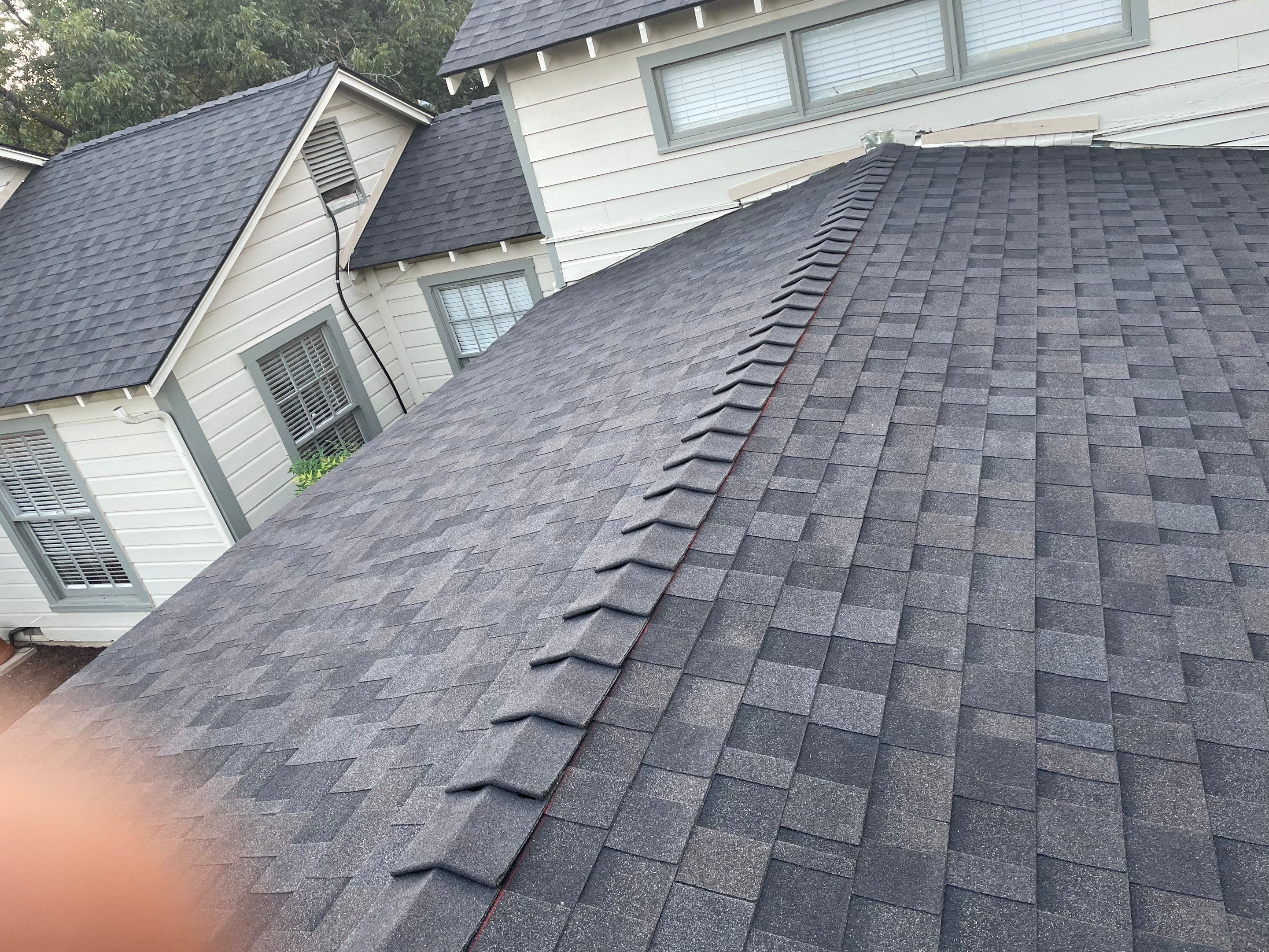 White exterior with IKO Glacier by Tejas Roofworks + Restoration