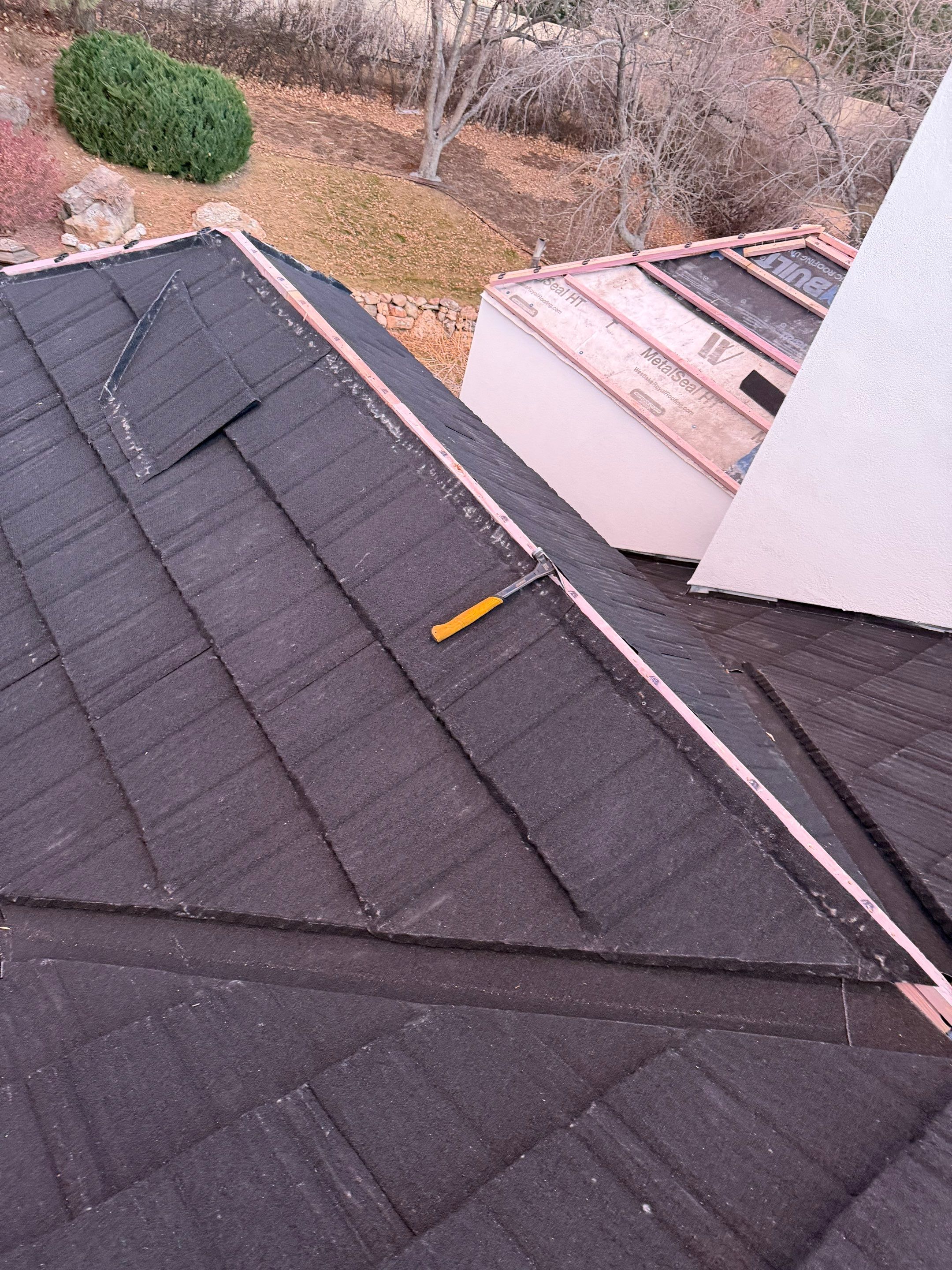 Unified Stone Coated Roof & Stucco Remodle by Blue Peaks Roofing LLC