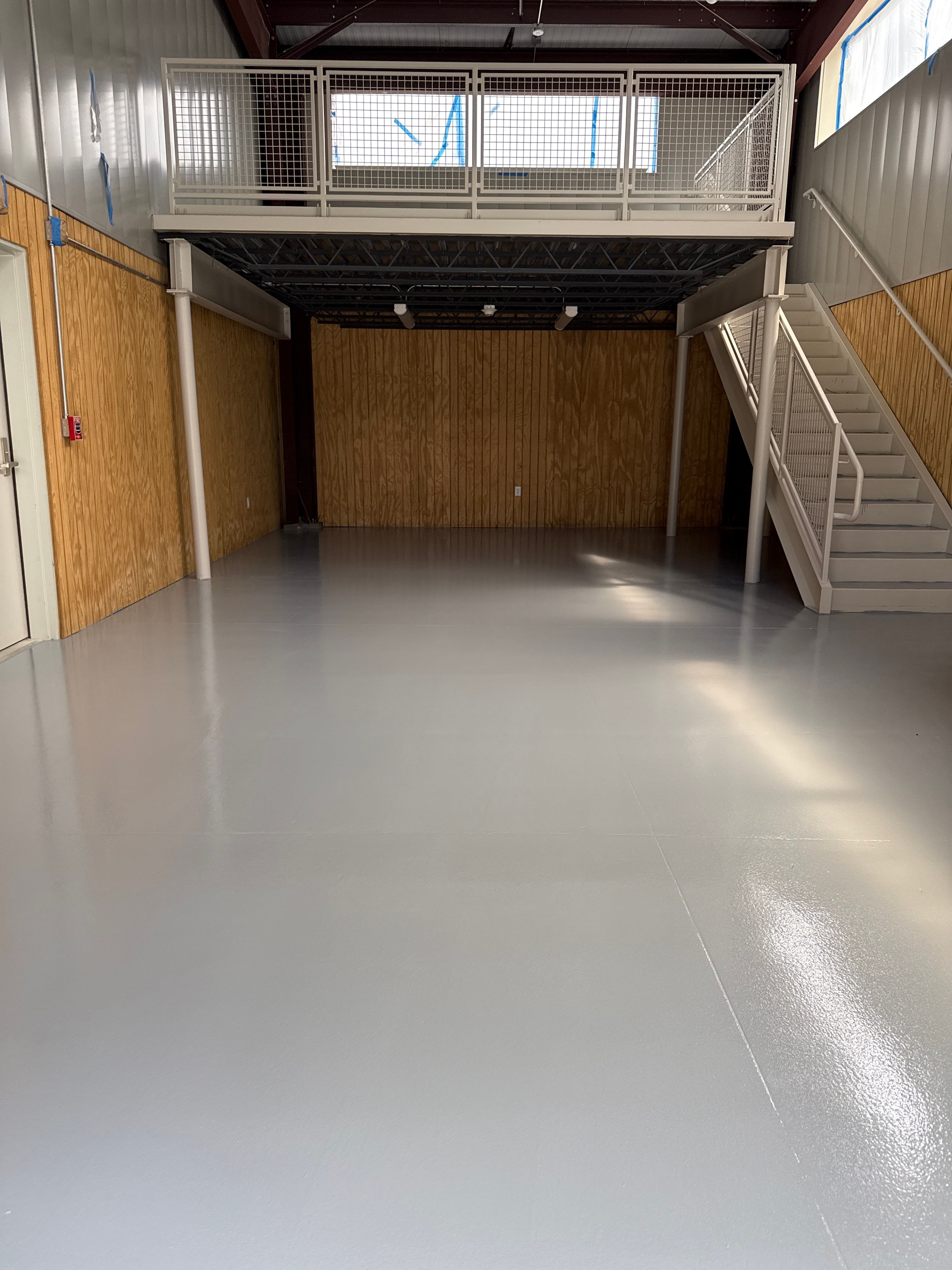 Industrial Epoxy Flooring for Sandhill Crane Workshop in Gautier by Cornerstone Hard Surface Restoration 