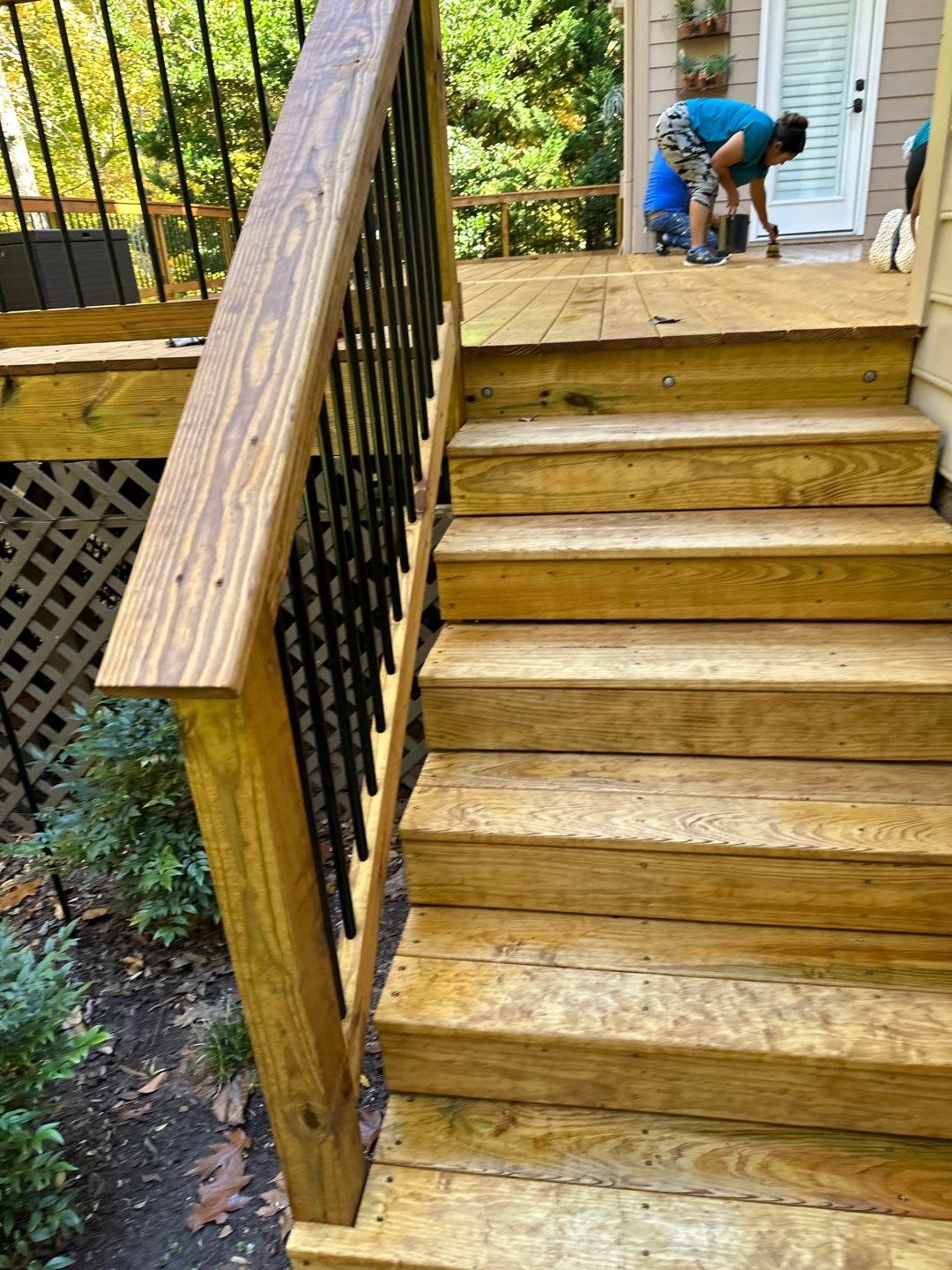 Pressure-Treated Deck Resurface with Black Aluminum Balusters in Broadway by The Remodeling Company
