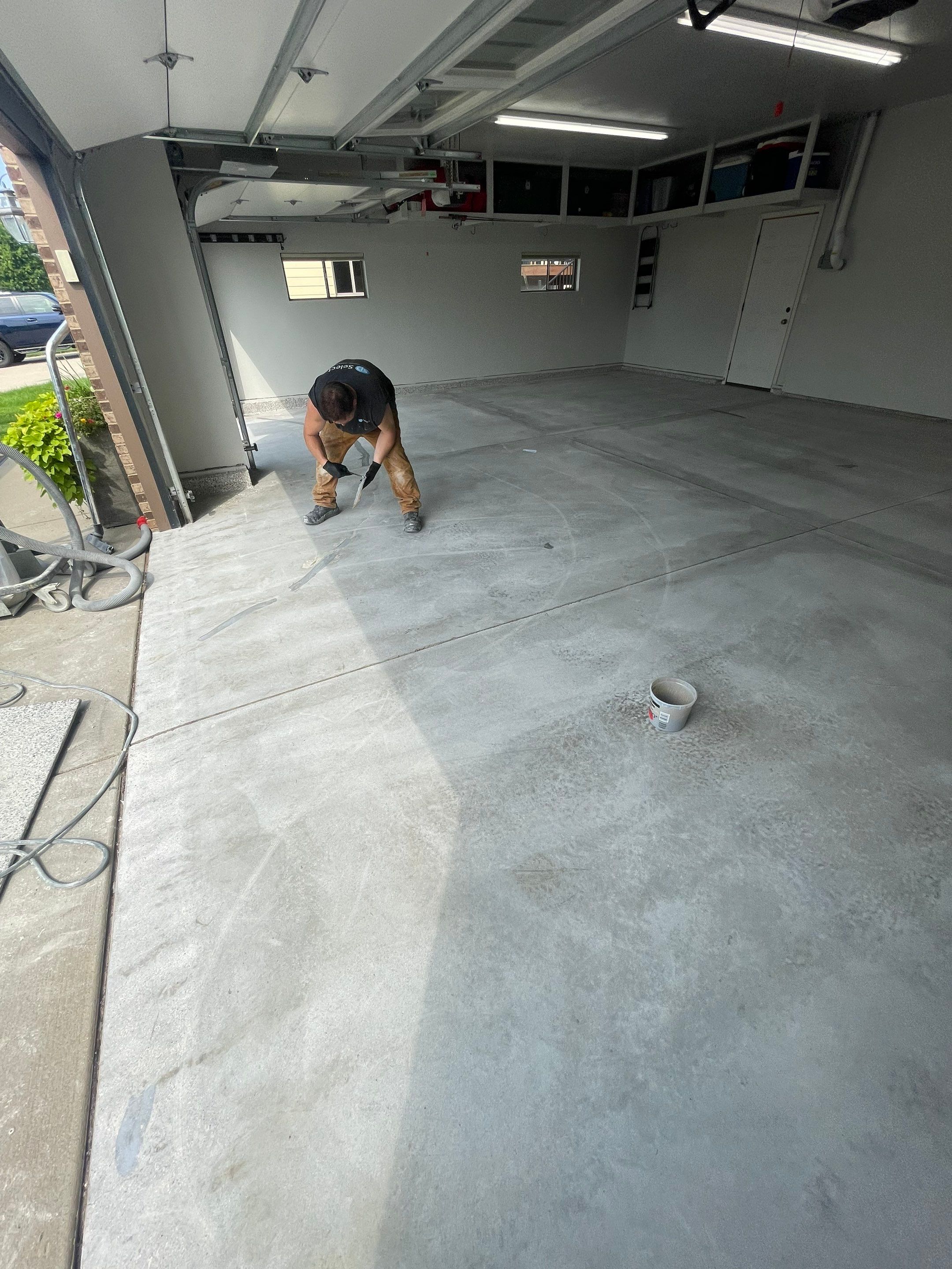 Multi-Car Garage Floor Coating and Crack Repair in Tea by Select Painting, Coatings & Garage Cabinets