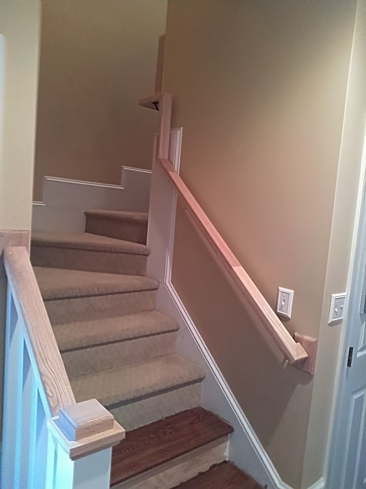 Stairway Installation using Red oak modern railings by House Custom Carpentry, LLC